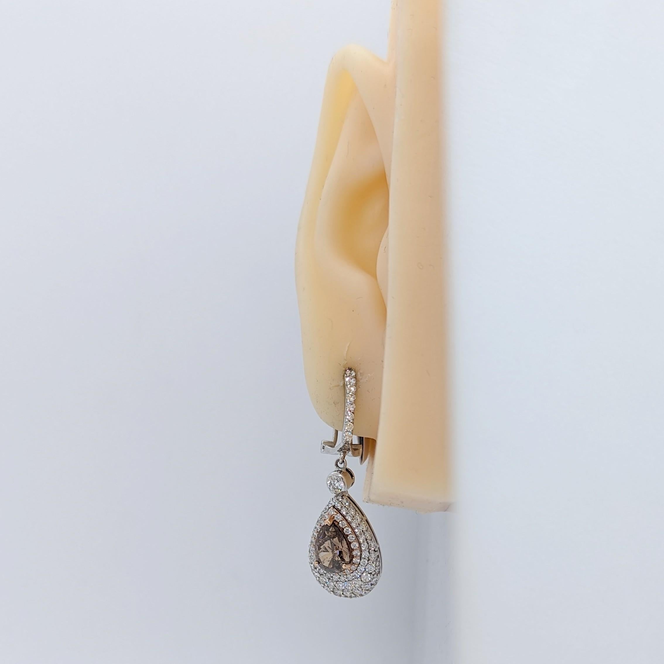 Beautiful dangle earrings with 5.99 ct. brown and white diamond pear shapes and rounds.  Handmade in 14k white and rose gold.