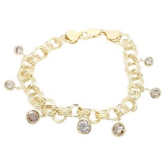 Bracciale a spirale con diamanti marroni e pietra centrale incastonata