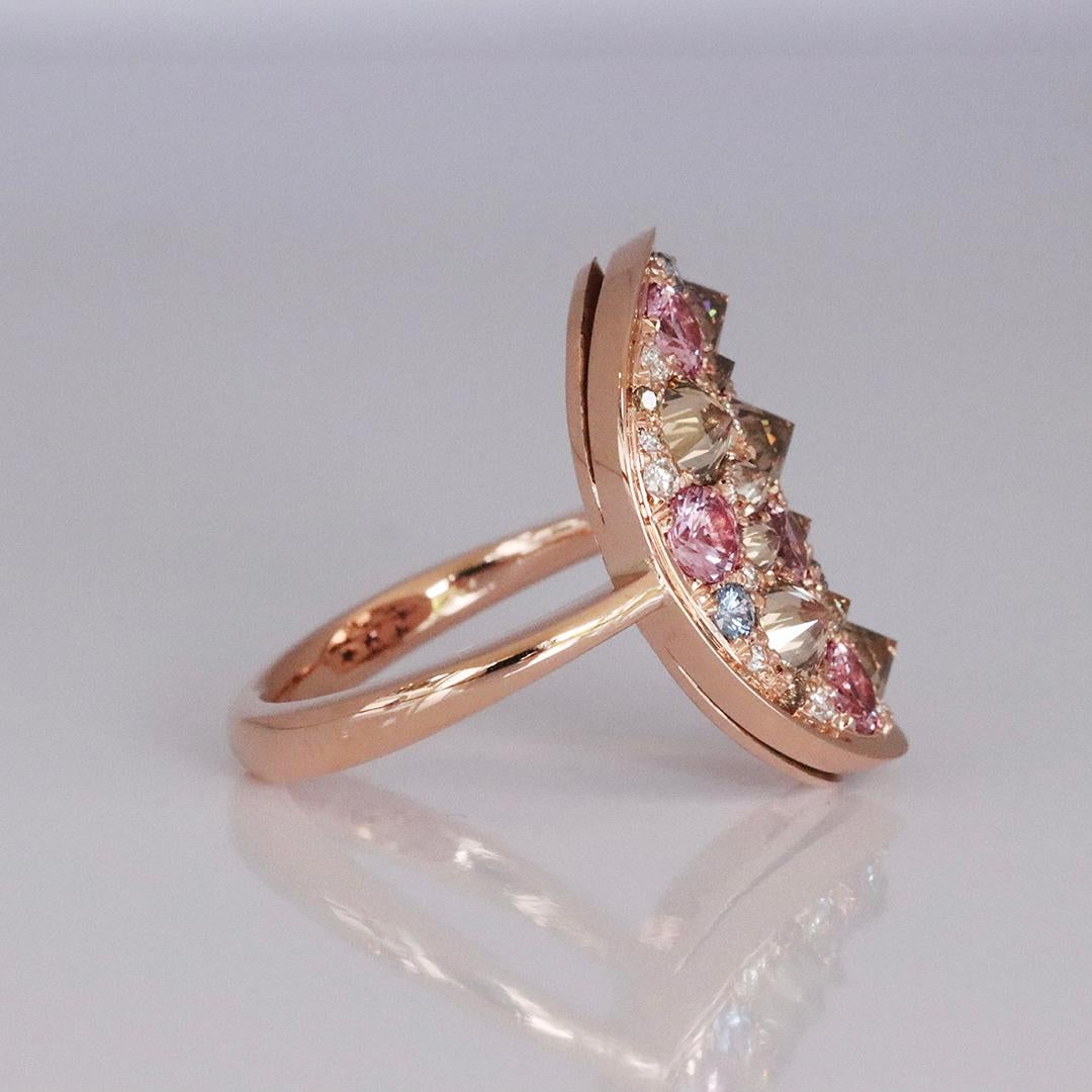 This exquisite rose gold ring is a testament to Belgian craftsmanship, created entirely by hand without any casting or printing techniques. 
It features a unique arrangement of upside-down set brown diamonds that offer a distinctive twist.