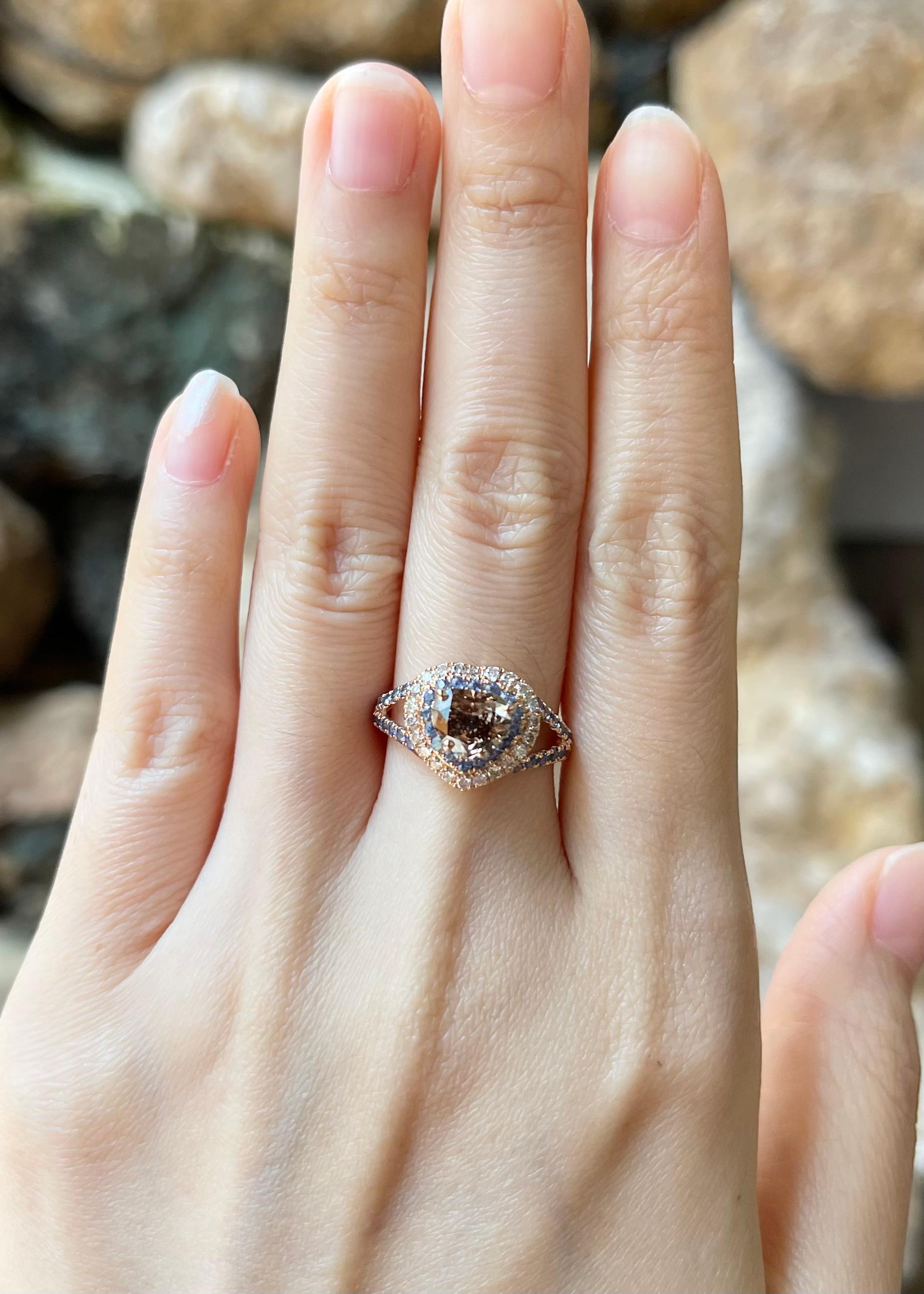 Brown Diamond 1.01 carats with Blue Sapphire 0.62 carat and Brown Diamond 0.28 carat Ring set in 18K Rose Gold Settings

Width:  1.3 cm 
Length: 1.2 cm
Ring Size: 53
Total Weight: 4.47 grams

