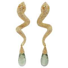 Boucles d'oreilles serpent en or 18 carats serties d'un diamant brun et d'une améthyste verte