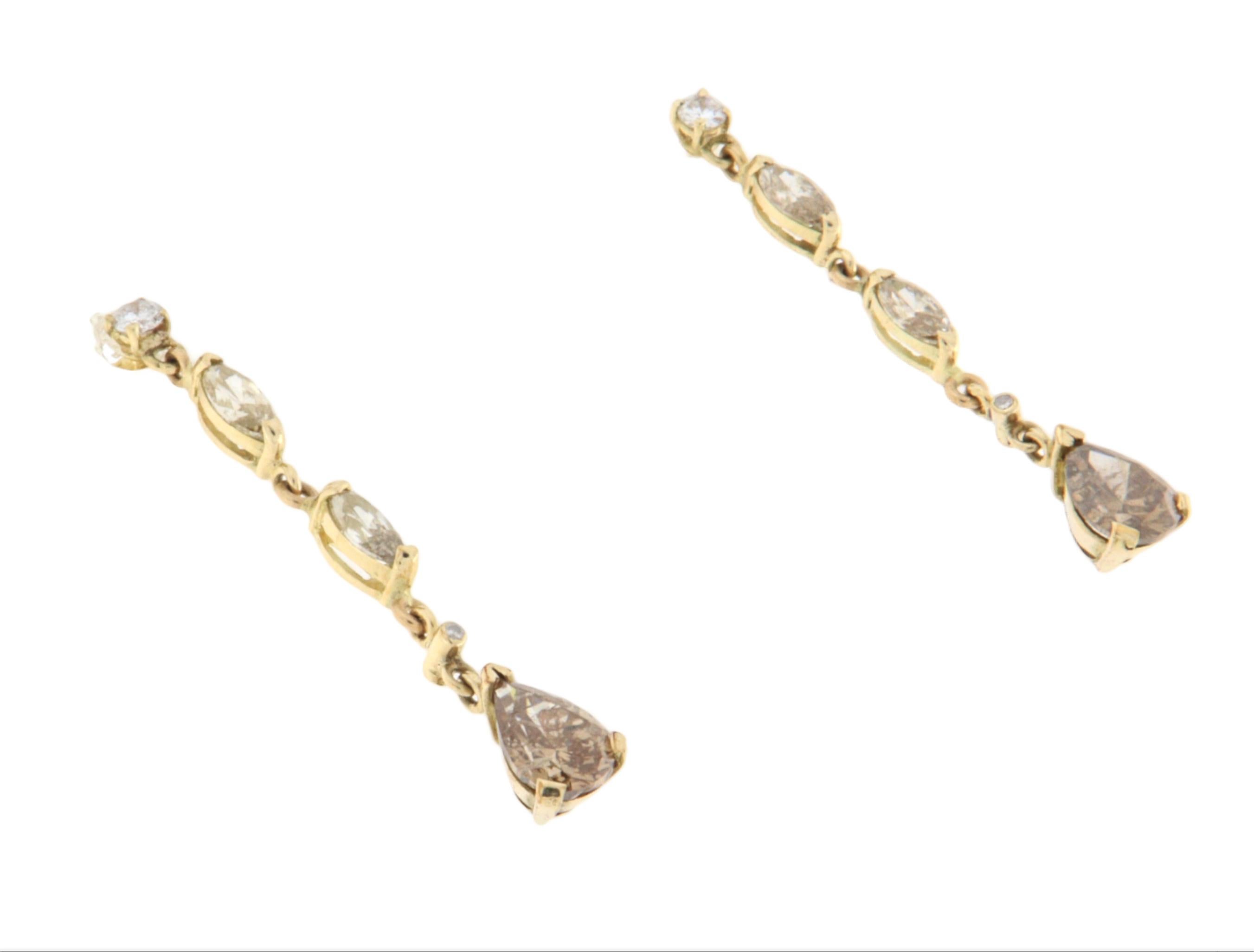 A perfect balance of brilliance and warm tones defines these elegant drop earrings crafted in 14-karat yellow gold, set with a selection of stunning brown diamonds. With a sophisticated and minimalist design, these earrings feature a slender,
