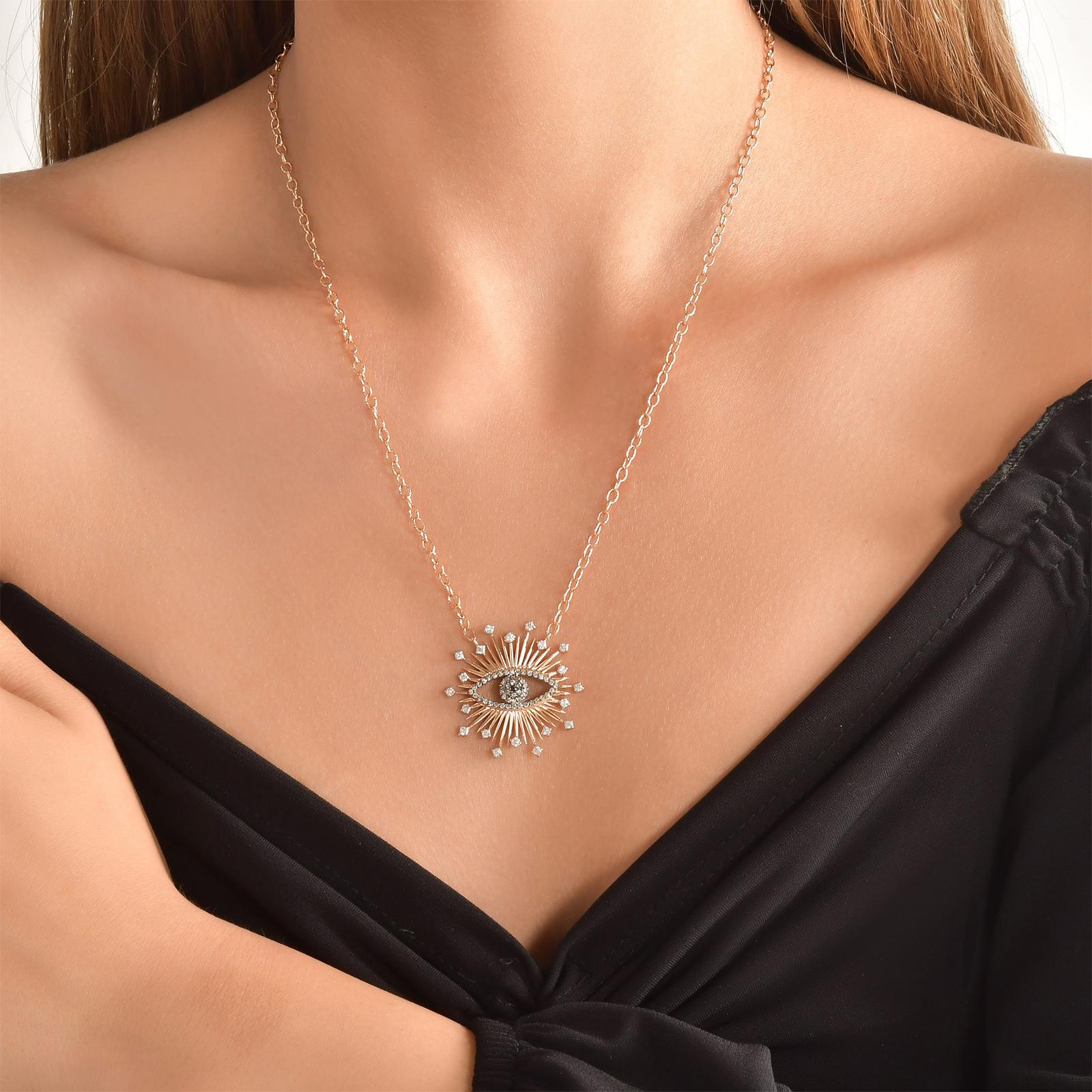 From the Evil Eye Collection. Reflecting the Universal Symbol of Protection. 

Metal Type 14 Karat Yellow Gold 
A number of Stones: 
20 White Diamonds: 42ct - E Color - SI Clarity
1 Black Diamond: 0.01
52 Brown Diamonds: .26ct.
Metal Weight