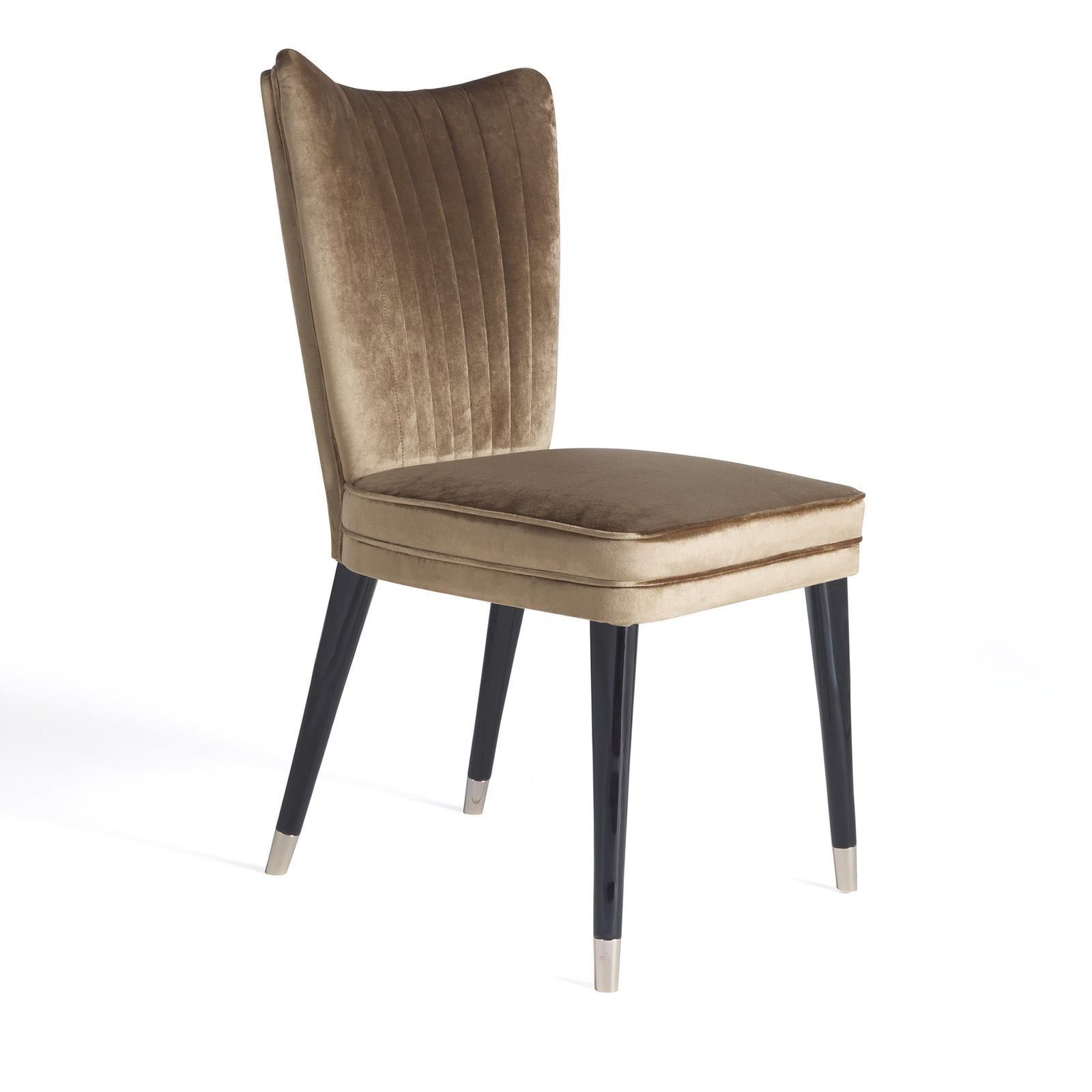 A classic piece that will enliven a sitting room, living room, or even the bedroom vanity, this refined chair will bring timeless, vintage style to any room. Crafted of wood, the streamlined silhouette features a broad, subtly flared back with a