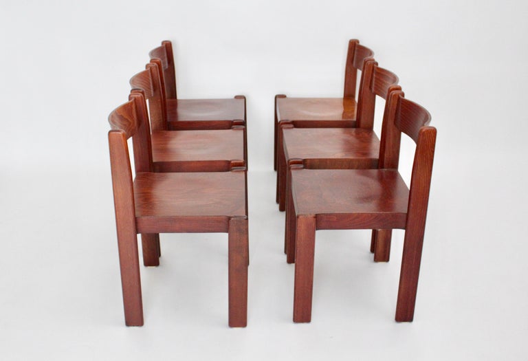 Mid Century Modern brown vintage dining chair set of six from brown stained beech and plywood 1970s Italy.
The seating comfort is very well!
The chairs are stackable up to five chairs.
Very good condition with small signs of age.

