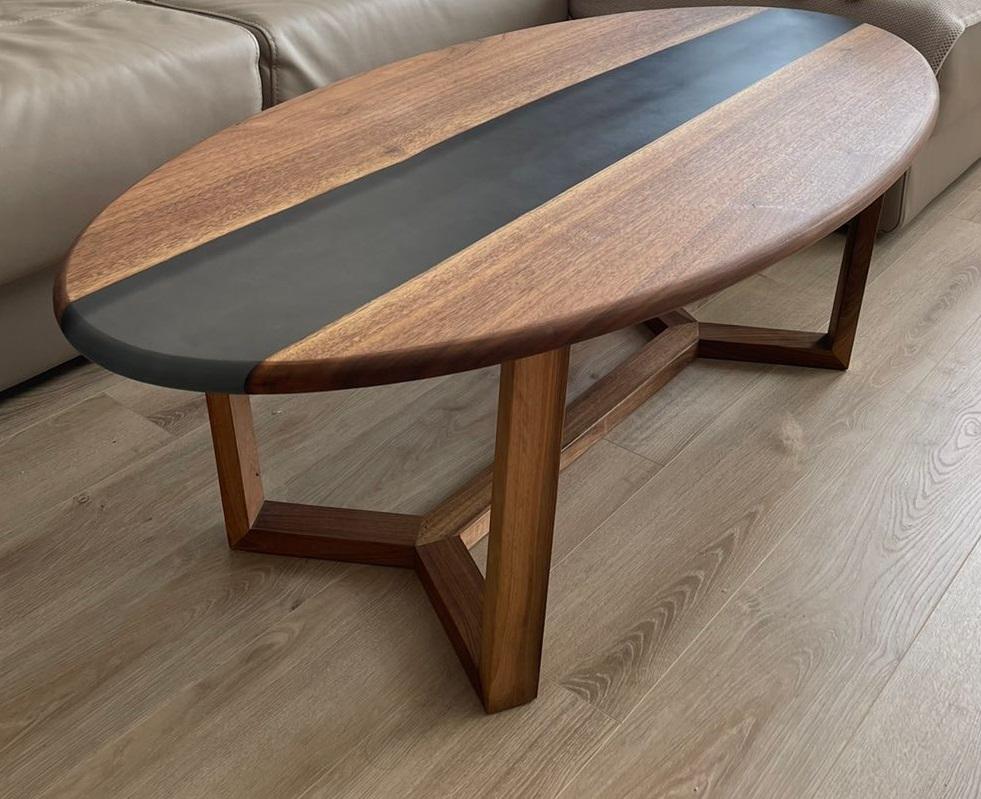 Brown Ellipse Coffee Table by KV Design
One Of A Kind
Dimensions: D 60 x W 120 x H 45 cm.
Materials: Walnut, epoxy resin, and wood.

Everything is custom-made 1 of 1 edition. Please contact us.

KV Design is a team of professionals, and we believe