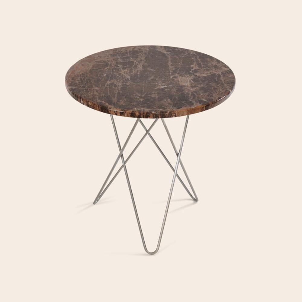 Brown emperador marble and steel tall mini O table by Ox Denmarq.
Dimensions: D 50 x H 50 cm
Materials: steel, brown Emperador marble
Also available: different top and frame options available.
Ox Denmarq is a Danish design brand aspiring to make