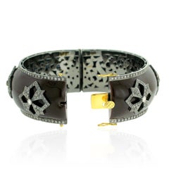 Brown Enamel and Diamond Bangle in Gold and Silver
