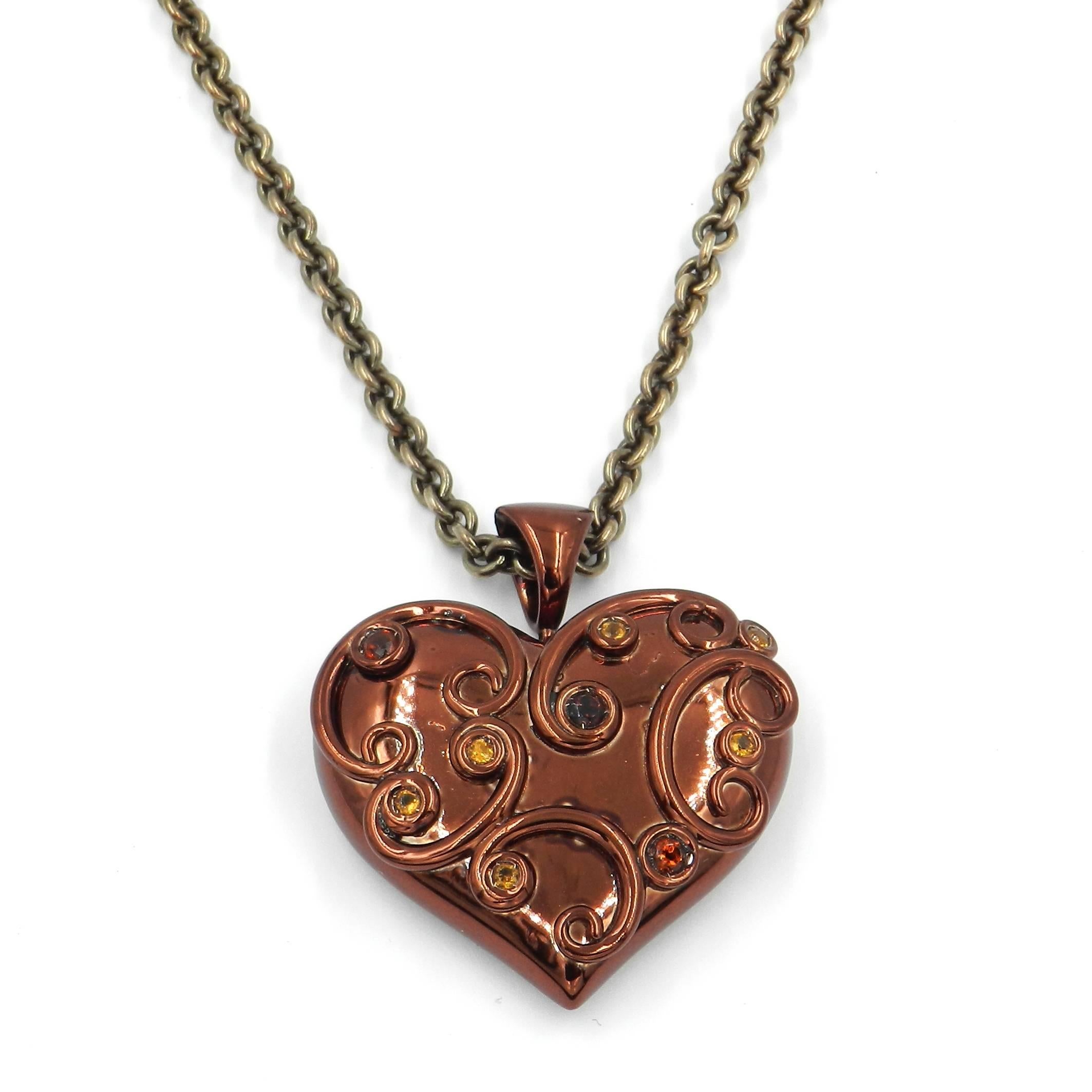 Originally designed across the millenium this fabulous chain with a brown enamelled heart pendant is in silver and features a total of carat 0.80 of citrine, madera citrine and smoky quartz. The pendant size is mm 40 x 35 . The chain lenght is 50