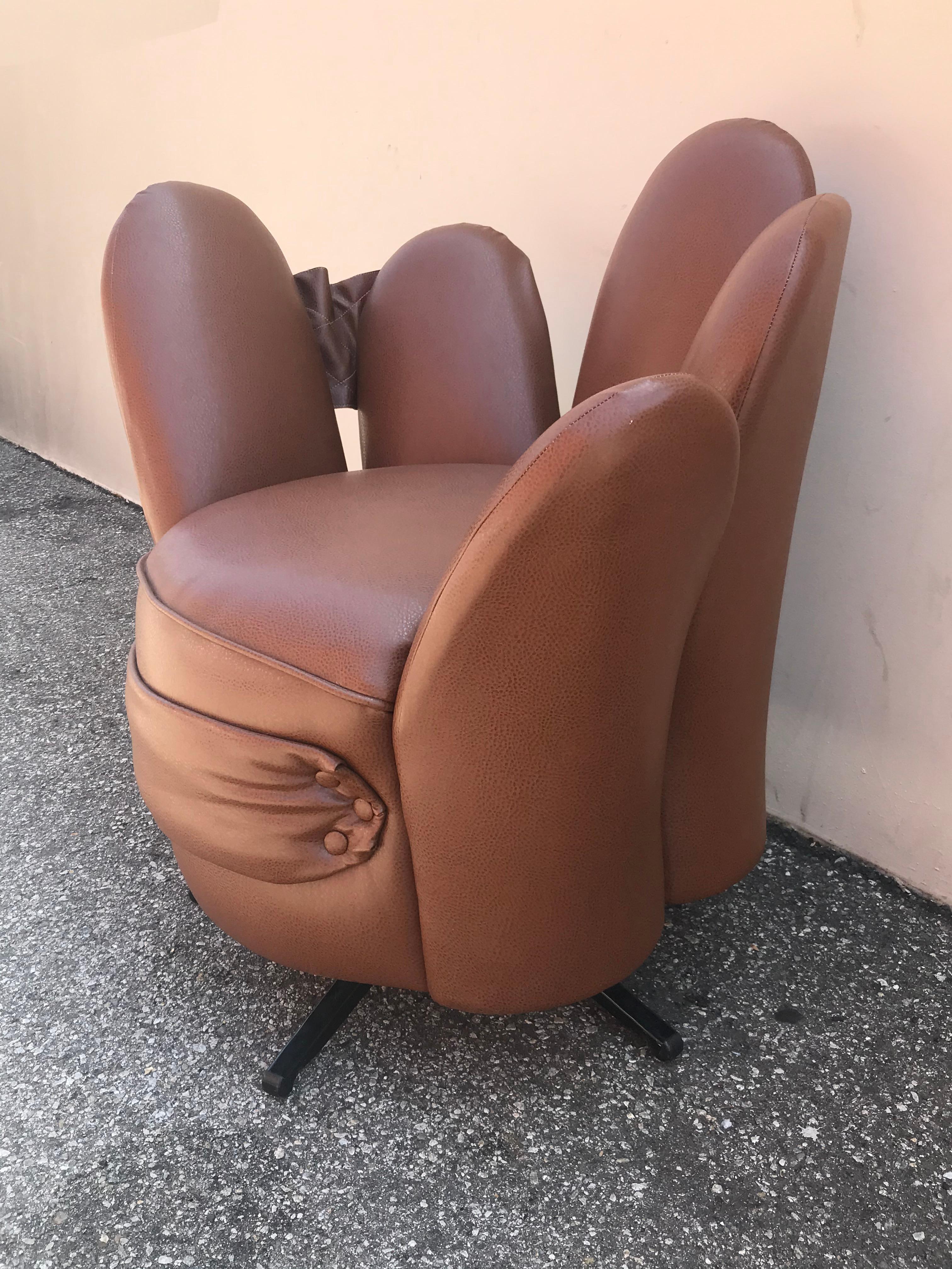 Quirky, very comfy chocolate brown five-finger swivel chair. Each finger can be used as a backrest.
It also features a poach for magazines in its back between 2 fingers.
  