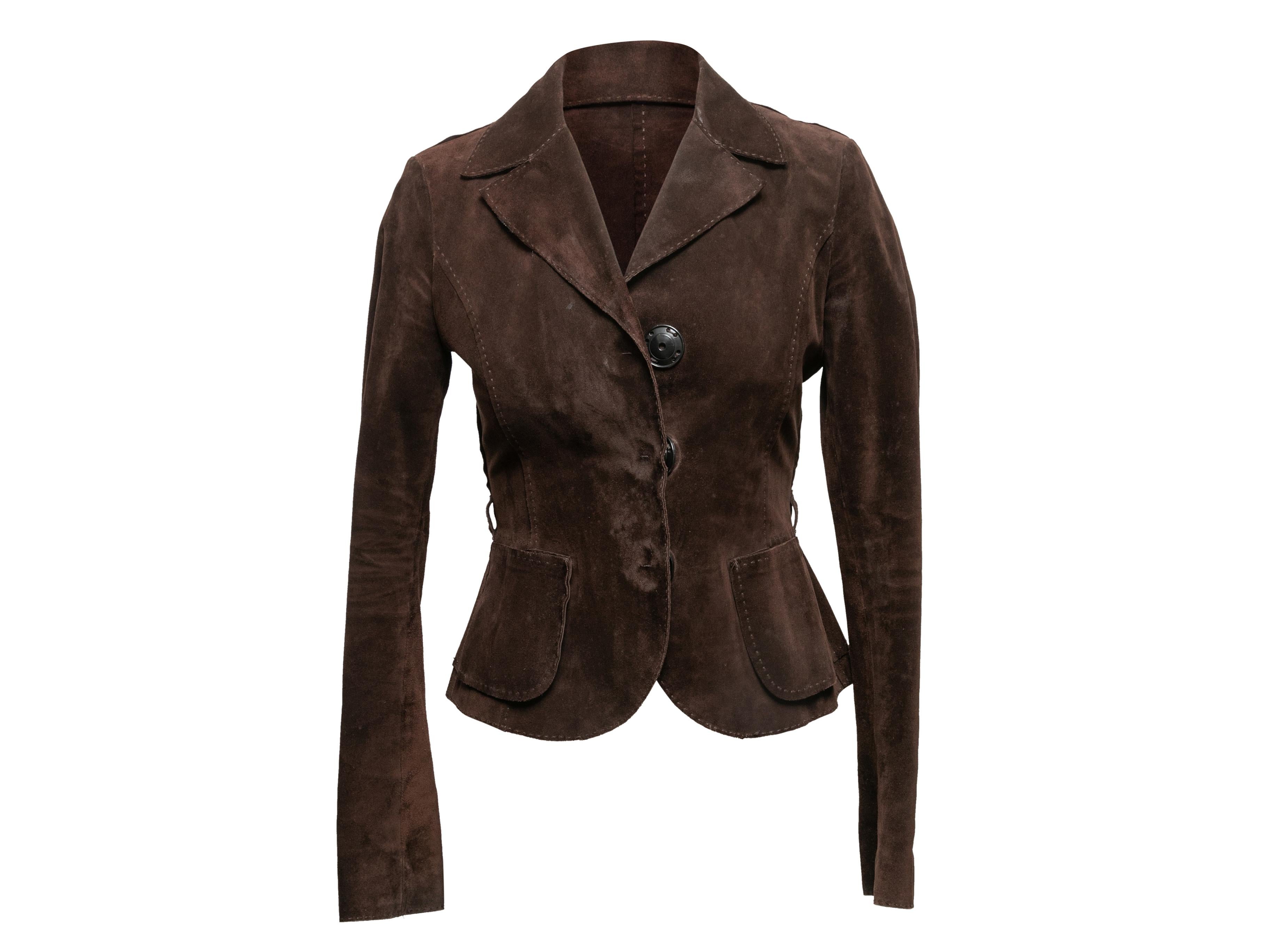Brown suede blazer by Fendi. Notched lapel. Dual hip pockets. Button closures at front.35