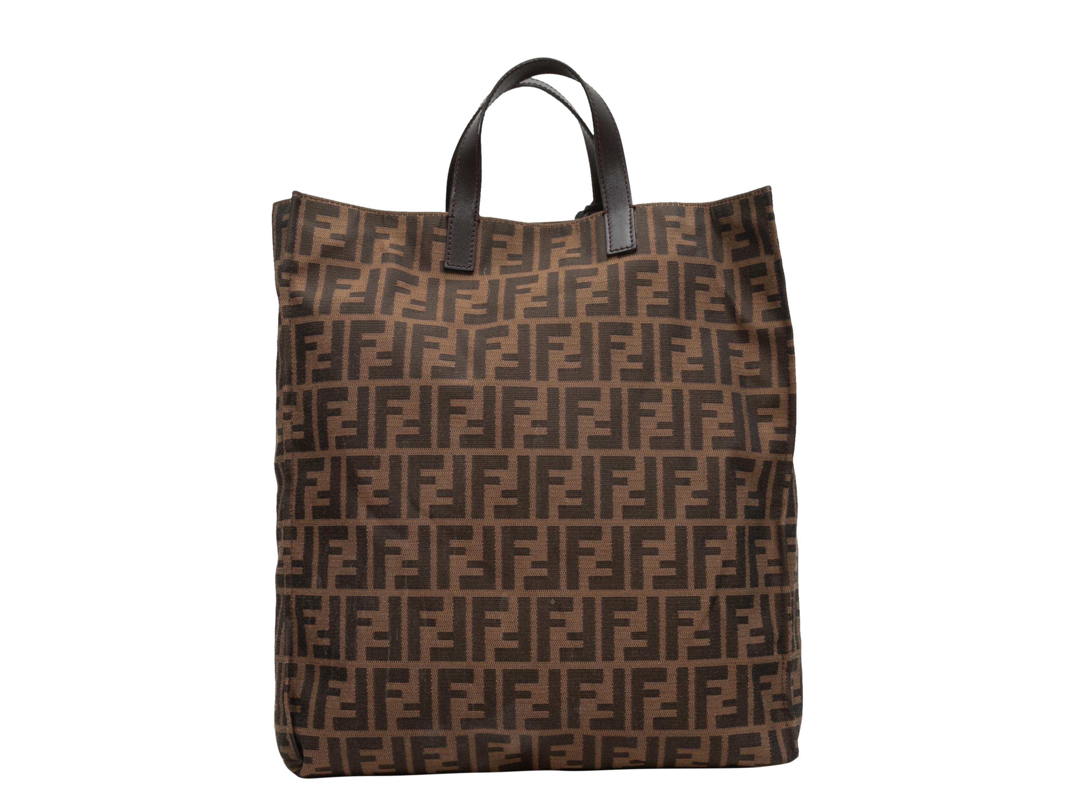 Brown Fendi Zucca Canvas Tote Bag. This tote bag features a Zucca canvas body and dual flat leather top handles. 13