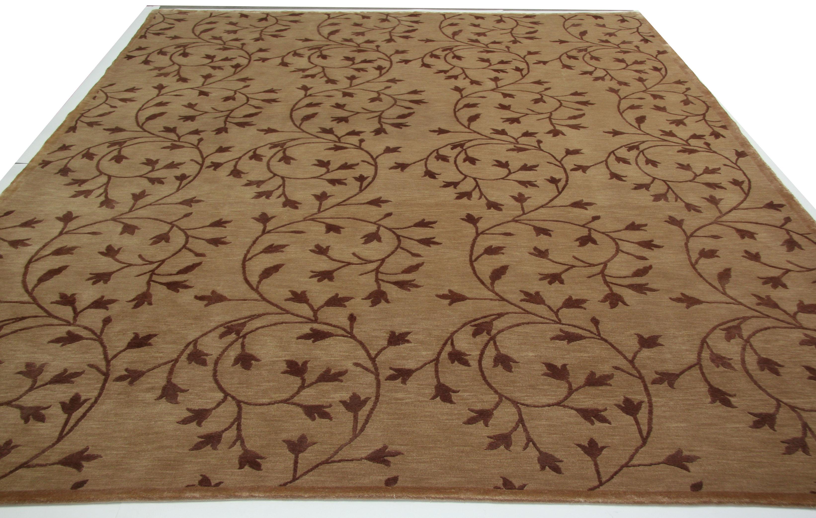 A delicate floral tracery winds its way across this charming wool area rug from Nepal. A lovely complement to wood tones and color palettes that aim to bring the outdoors inside. Hand knotting creates a 'light' and 'dark' side ('light' side shown