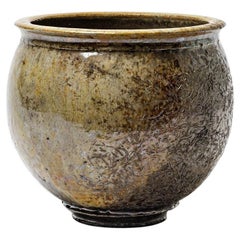 Brown glazed ceramic bowl with metallic highlights by Gisèle Buthod Garçon, 1990