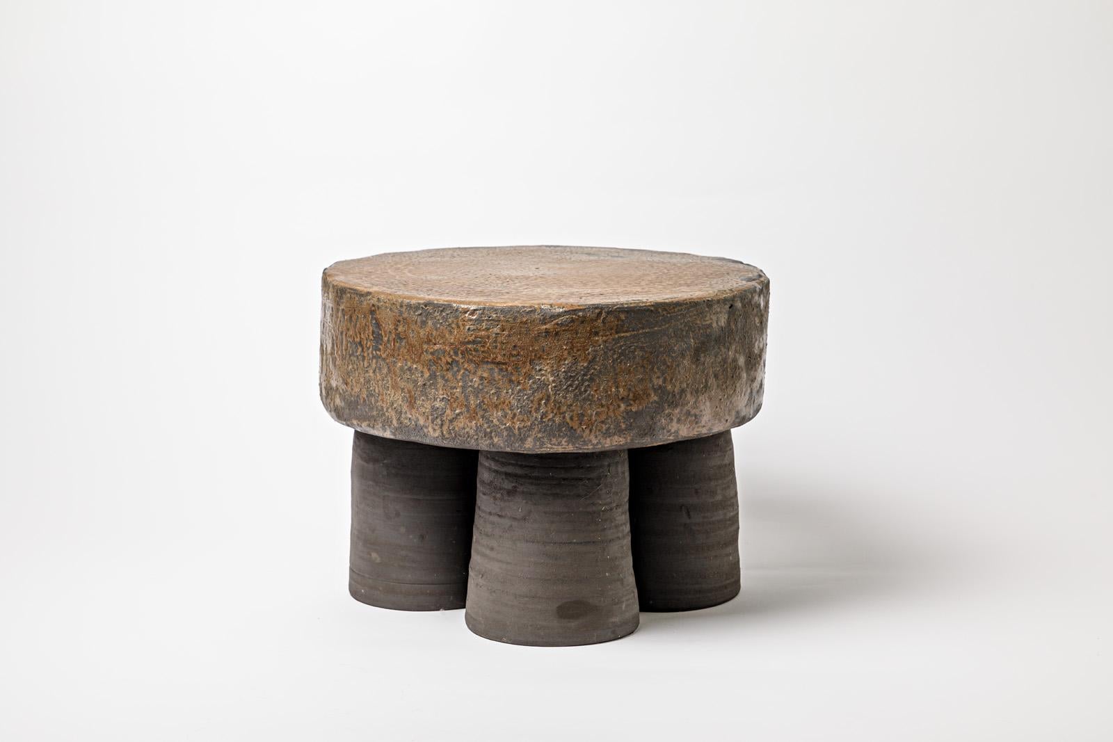 Brown glazed ceramic stool or coffee table by Mia Jensen. 
Artist signature under the base. 2023.
H : 11.02’ x 14.9’ inches.