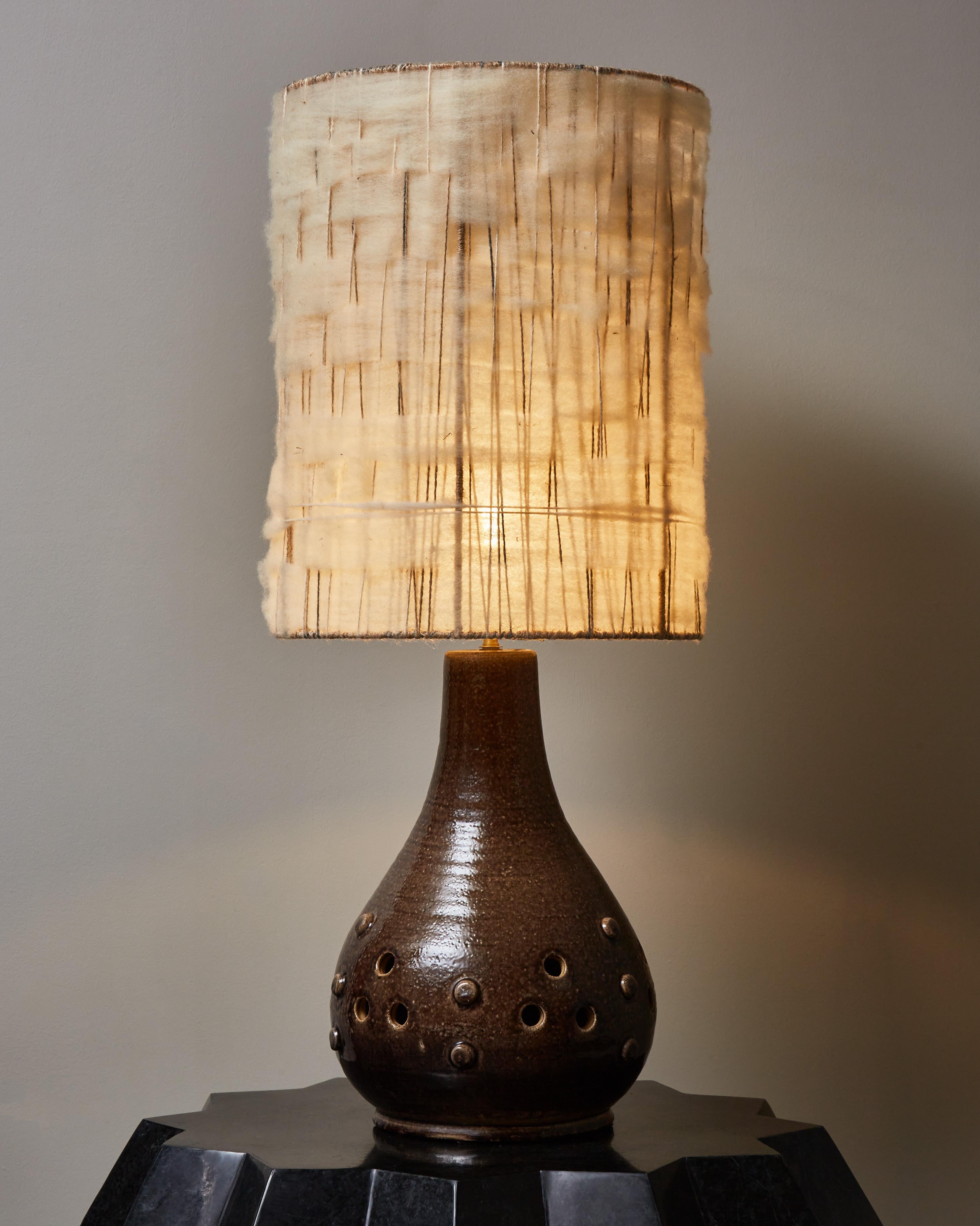 Ceramic table lamp with a beautiful deep brown glaze by Accolay, France 1970s.
Makes a « fausse paire » with our other Accolay lamp.
  
