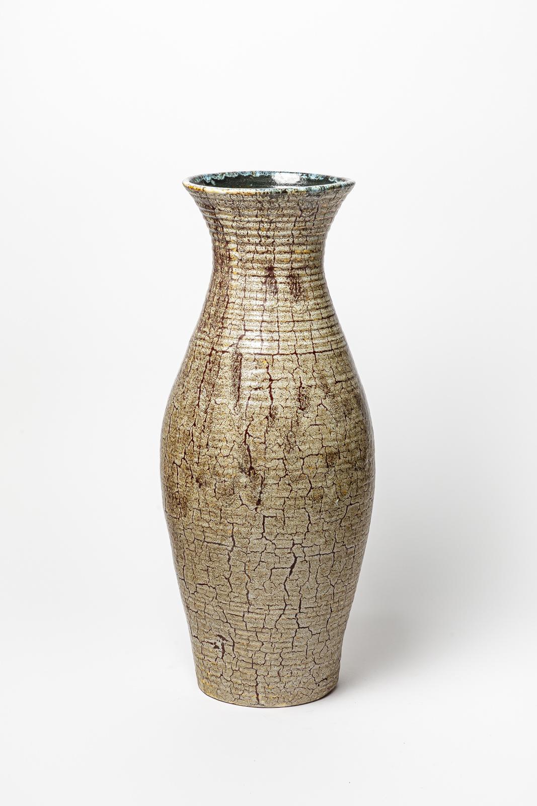 Brown glazed stoneware vase by Accolay.
Artist signature under the base. Circa 1960-1970. 
H : 21.6’ x 8.3’ inches.
