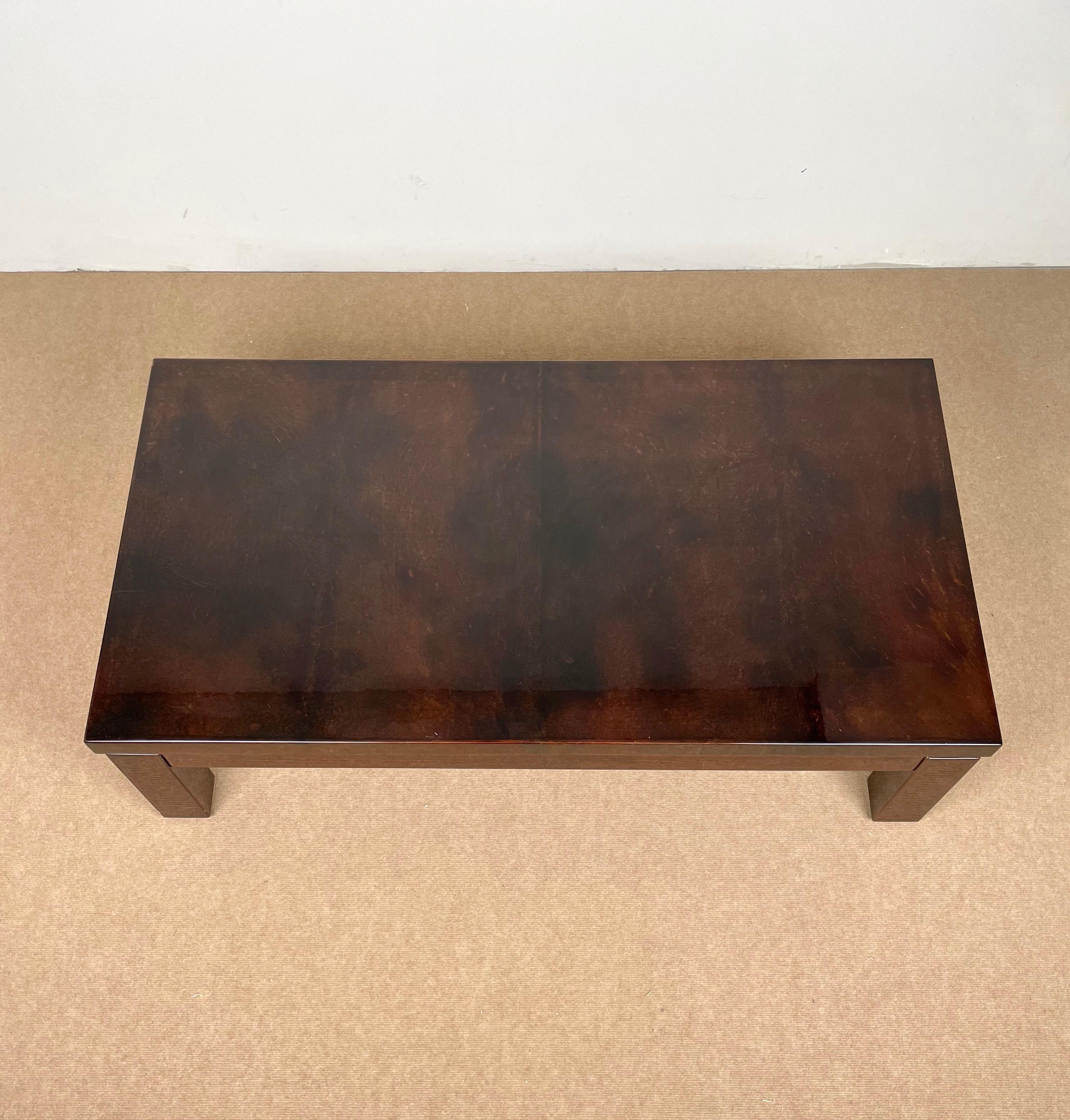 Rectangular coffee table in brown goatskin with brass details attributed to the Italian designer Aldo Tura. 

Made in Italy in the 1960s.