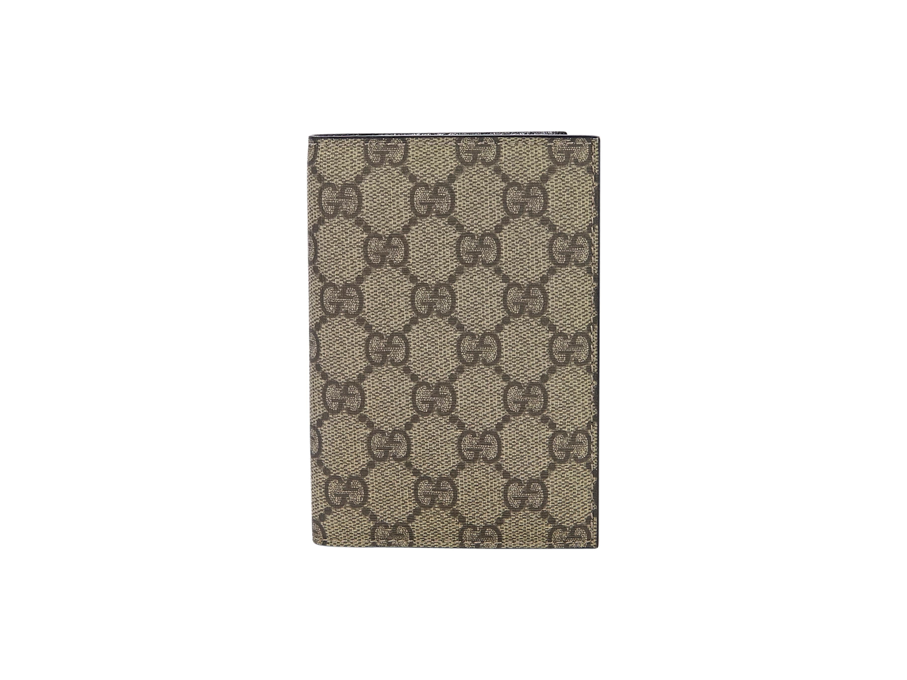 Product details:  Brown GG bifold wallet by Gucci.  Lined interior with multiple credit card slots.  6