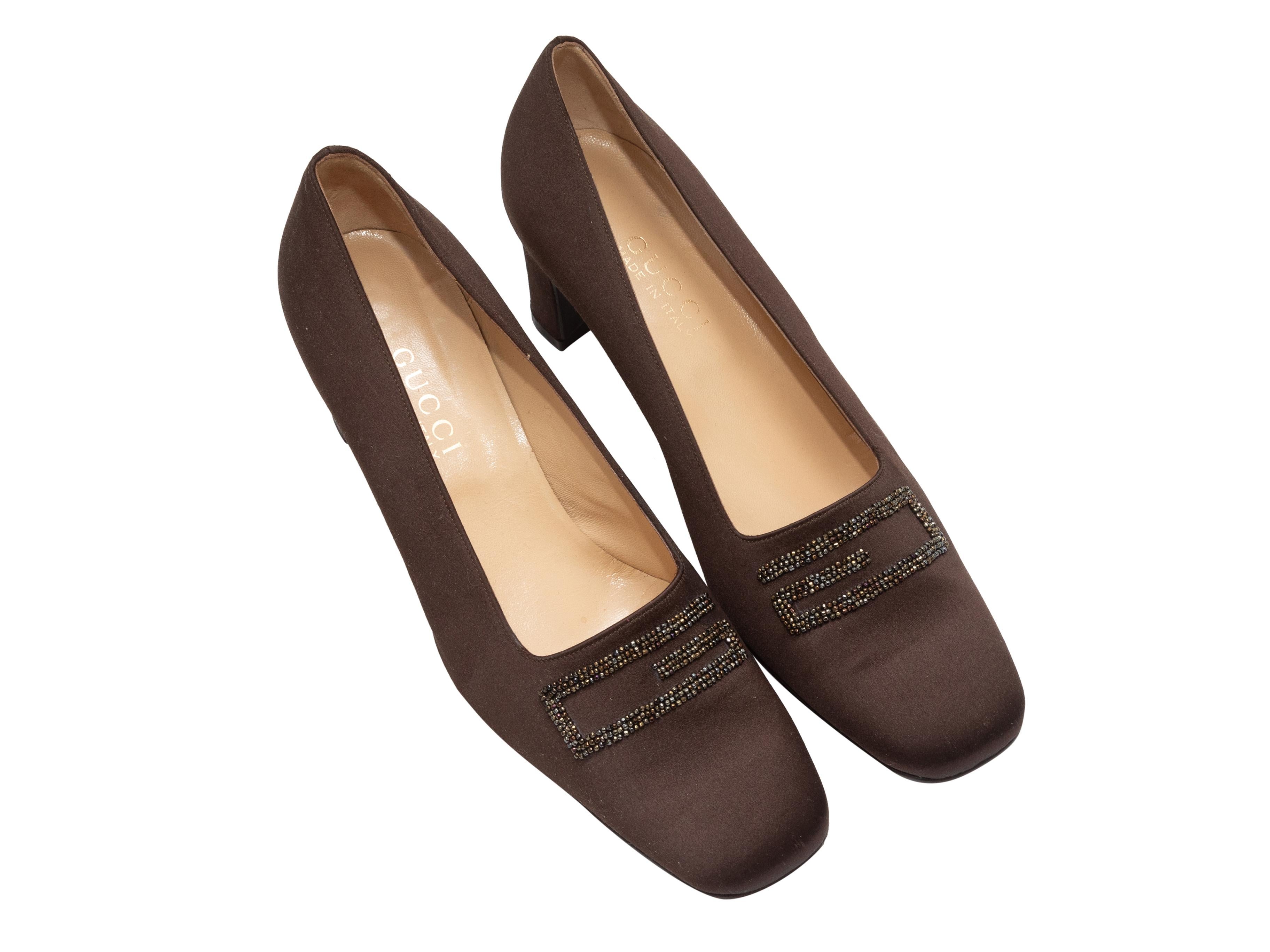 Brown satin square-toe pumps by Gucci. Beaded logo detailing at tops. Block heels. 2.3