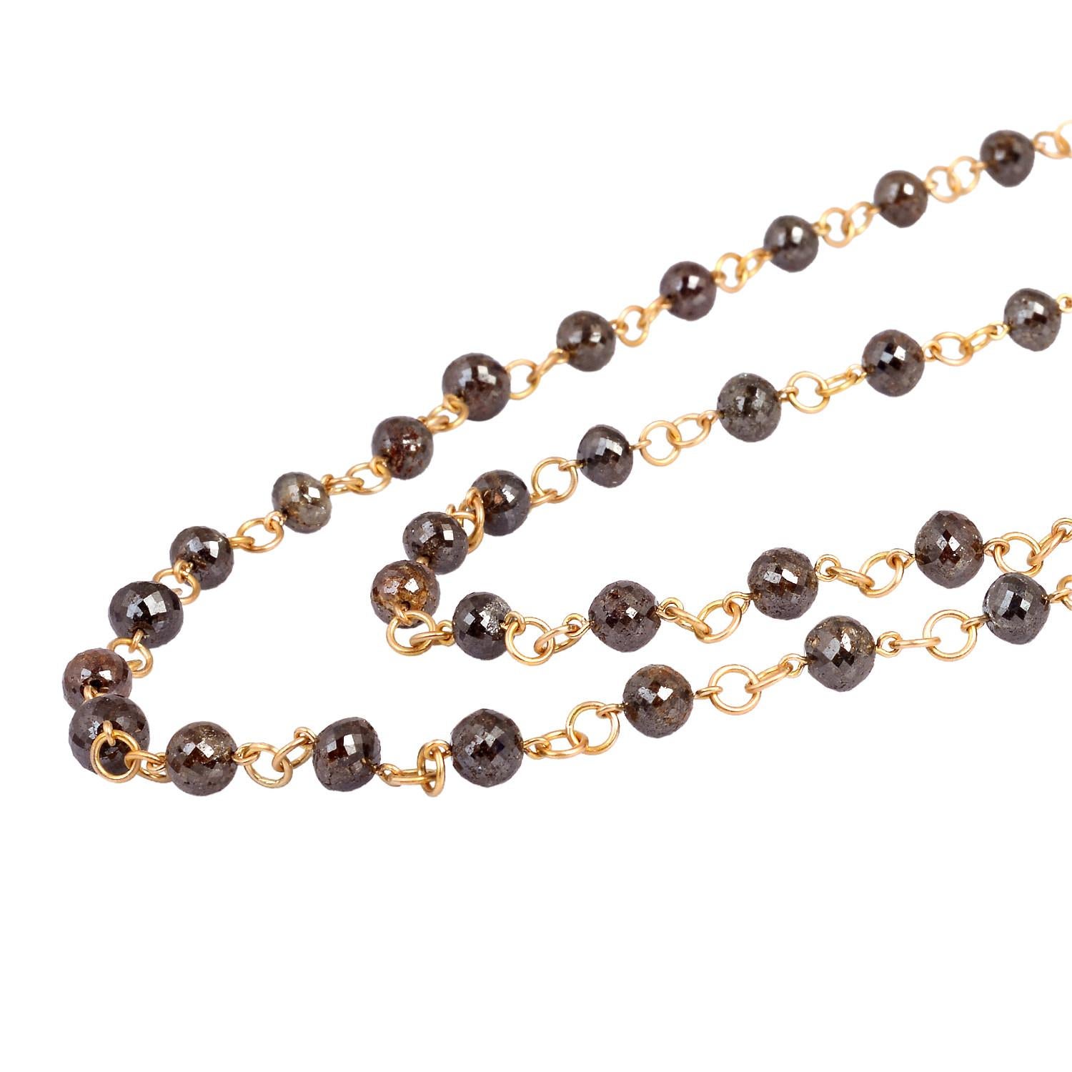 This Brown Ice Ball Diamond Necklace in 18K Rose Gold is exquisite and is 42 inch long. This necklace can be worn from over the head and can be layered.

Gold: 18KT:22.93gms
Diamind: 205.67cts