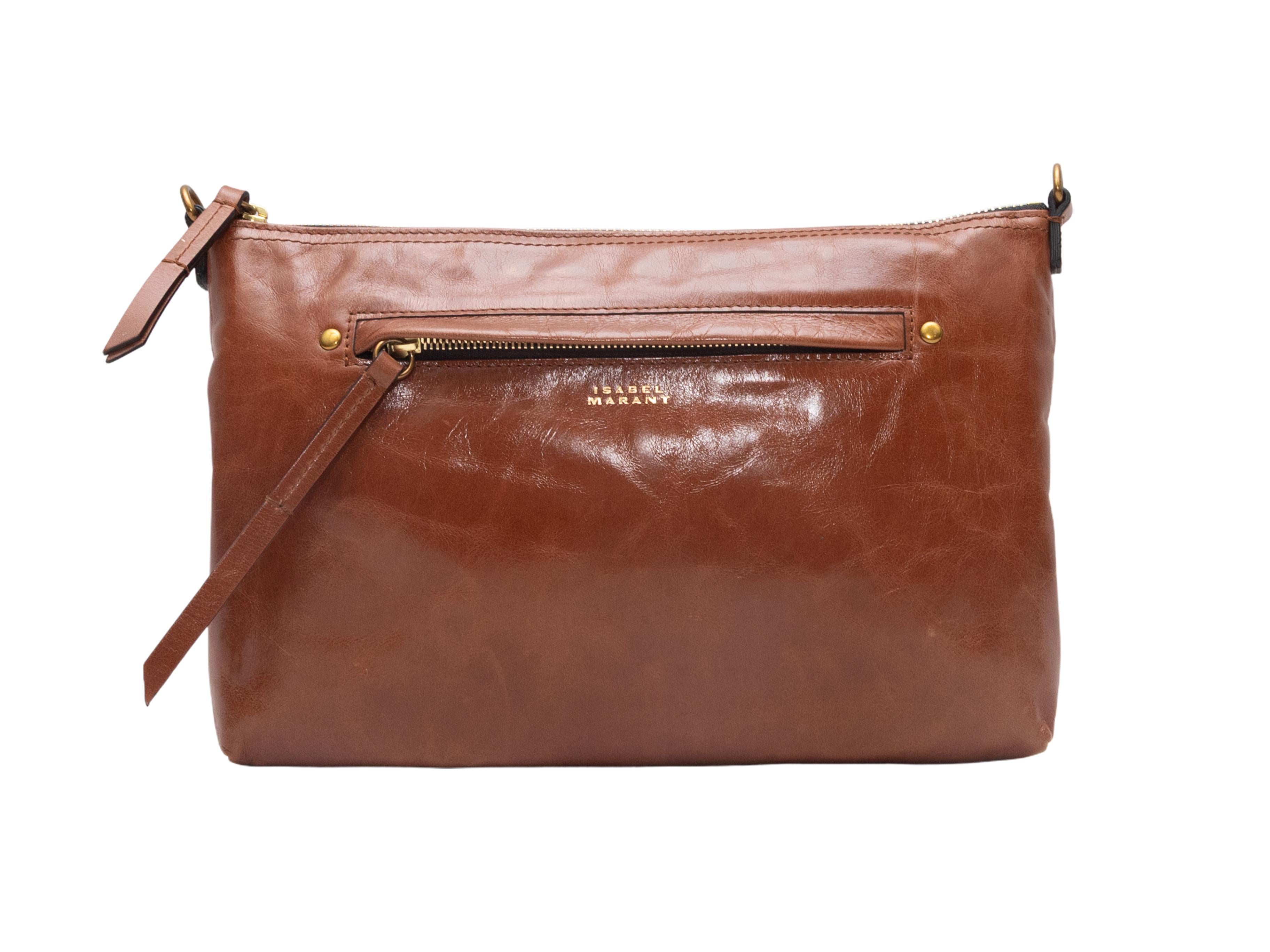 Sac à bandoulière en cuir Isabel Marant marron. Ce sac se compose d'un corps en cuir, de ferrures dorées, d'une poche frontale zippée, d'une seule bandoulière plate et d'une fermeture à glissière sur le dessus. 10