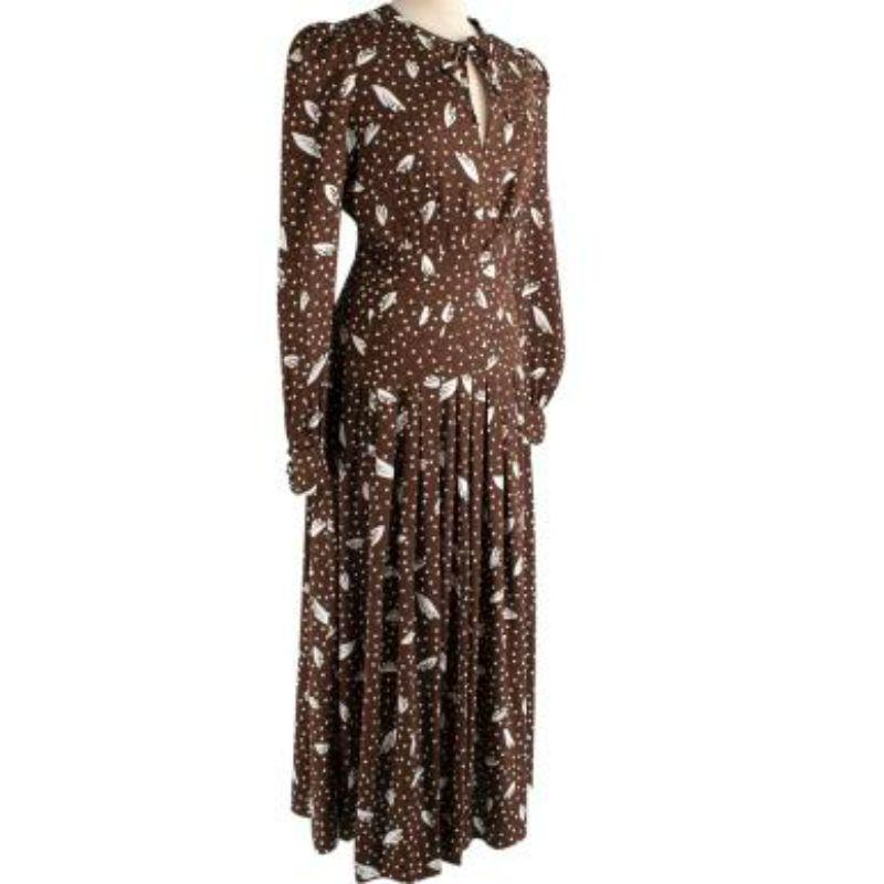 Alessandra Rich Brown & ivory polka dot silk satin jacquard
 
 - Retro-inspired silhouette in a fluid silk-satin jacquard
 - Polka-dot print interspersed with a leaf motif 
 - Self-tie keyhole neckline
 - Puffed long sleeve, with padded shoulder
 -