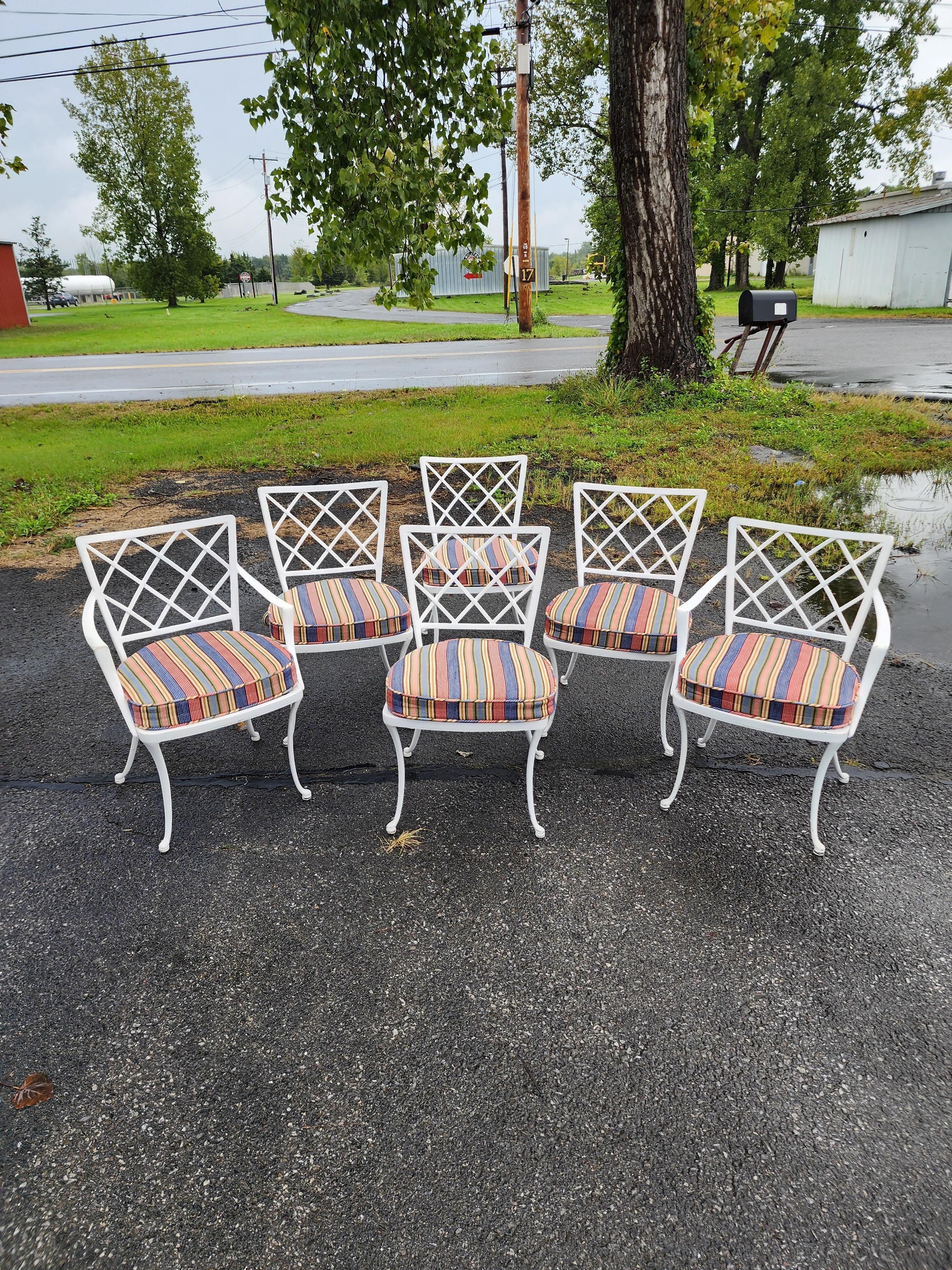 This is a very handsome set of brown and jordan Coastal cast aluminum chairs. Two arm and six side with custom cushions in excellent condition excluding the usual wear. Made in the last half of the twentieth century in the united states. These are