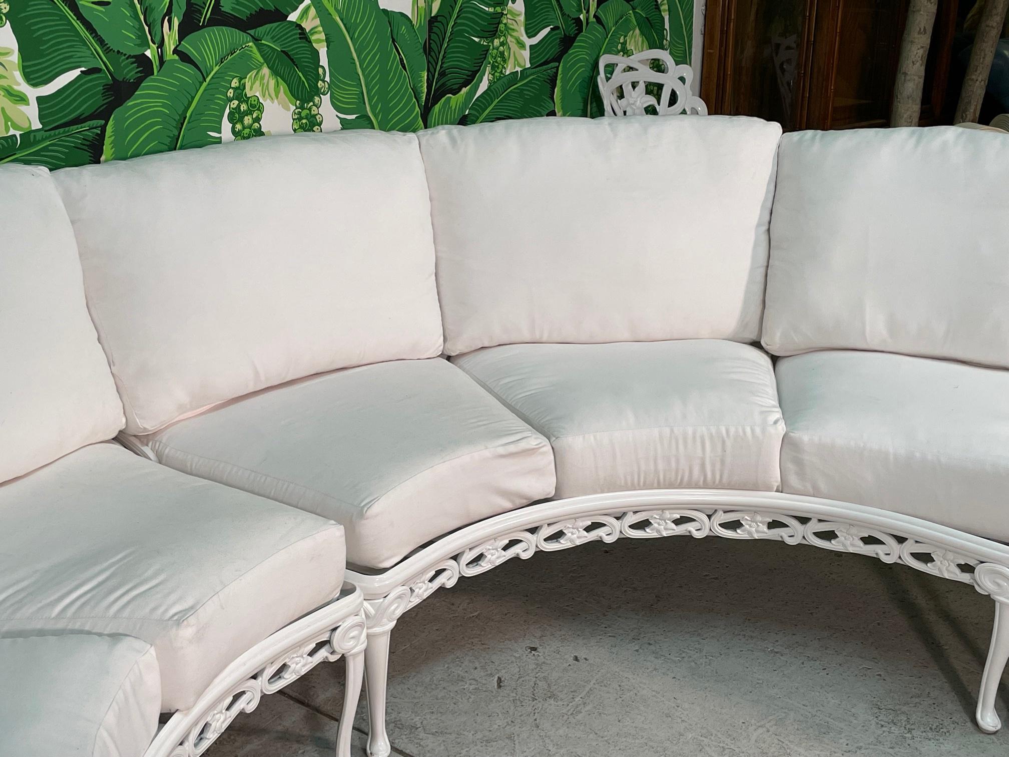 Large round cast aluminum patio sofa by Brown Jordan from their Day Lily collection. Sold exclusively through Nieman Marcus.  Four pieces total. Extremely comfortable cushions and perfect incline make for a very relaxing feel, more so than most