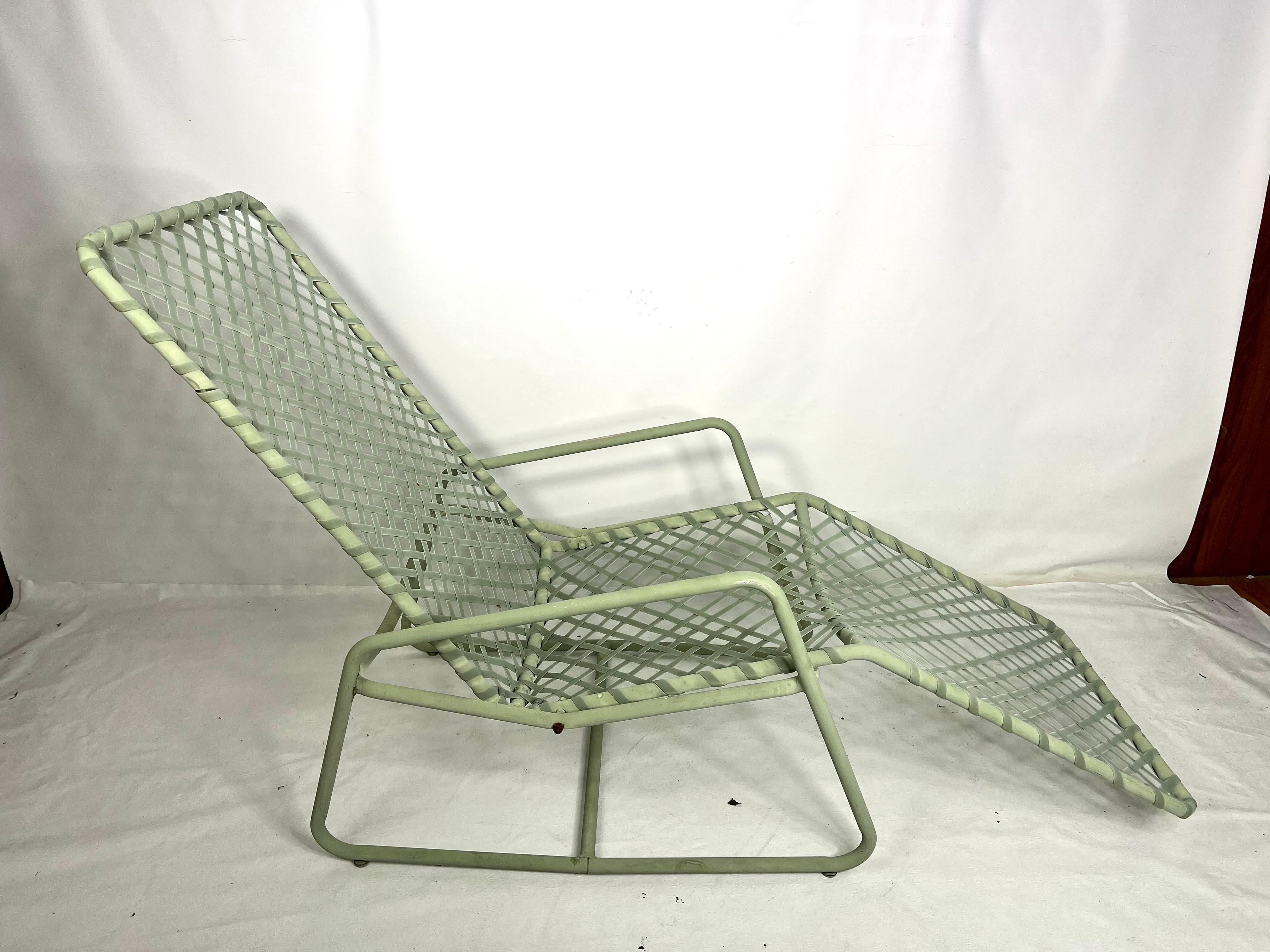 This is a very unique lounge chair made by brown Jordan in pale green. The lounge chair does tilt back and the seat h is 15.75”