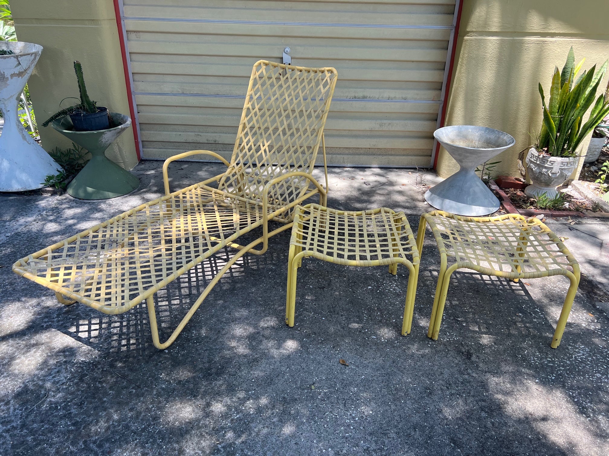 A collection of five Brown Jordan vintage outdoor pieces. Chaise (adjustable back), 2 stools and an armchair with ottoman. Ottomans measure 21.5 x 21.5 x 16