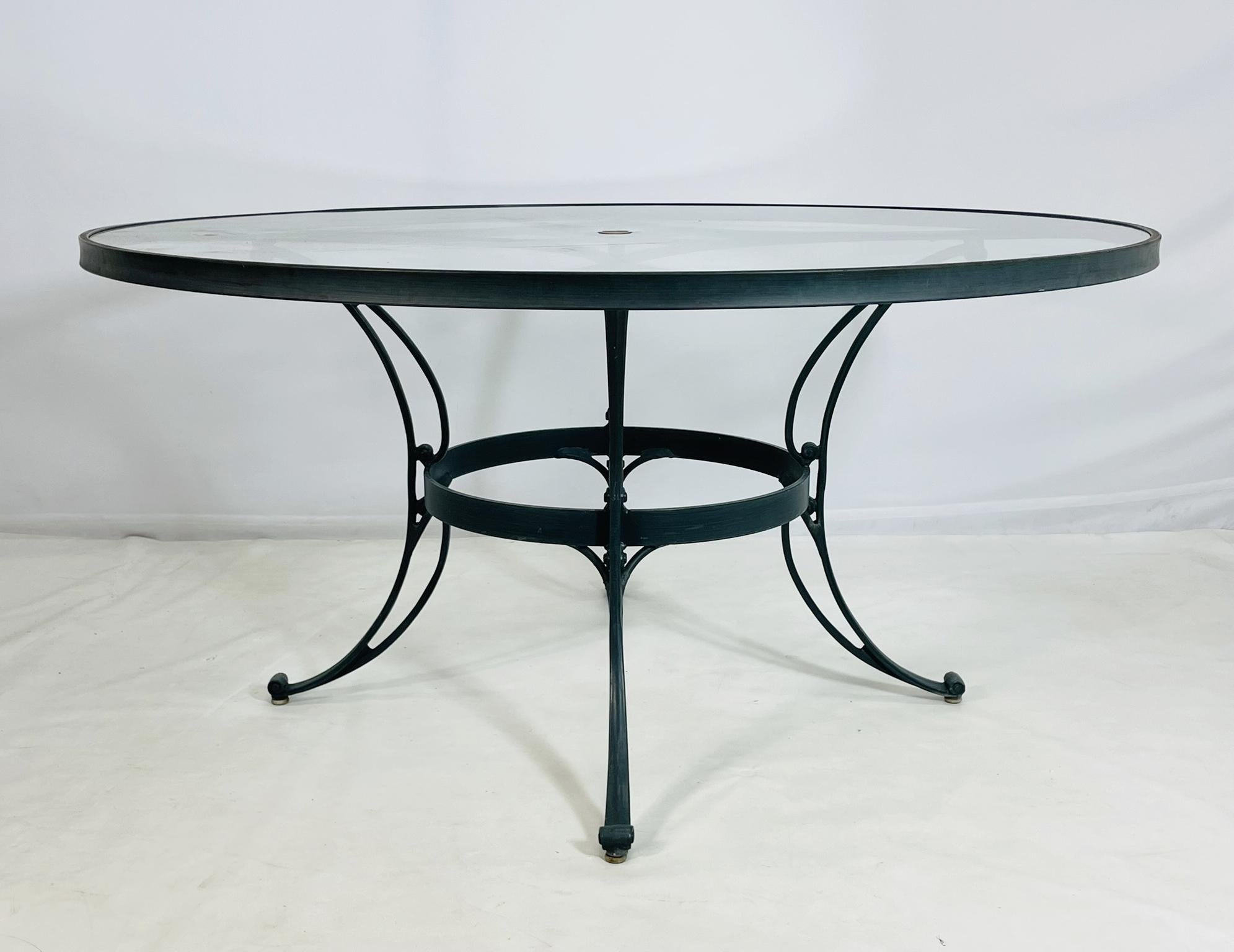 A timeless aluminum patio dining table by Brown Jordan, one of the most respected names in outdoor furniture design. Crafted in the USA, this round table features a durable aluminum frame with sculptural curves and an elegant powder-coated finish,
