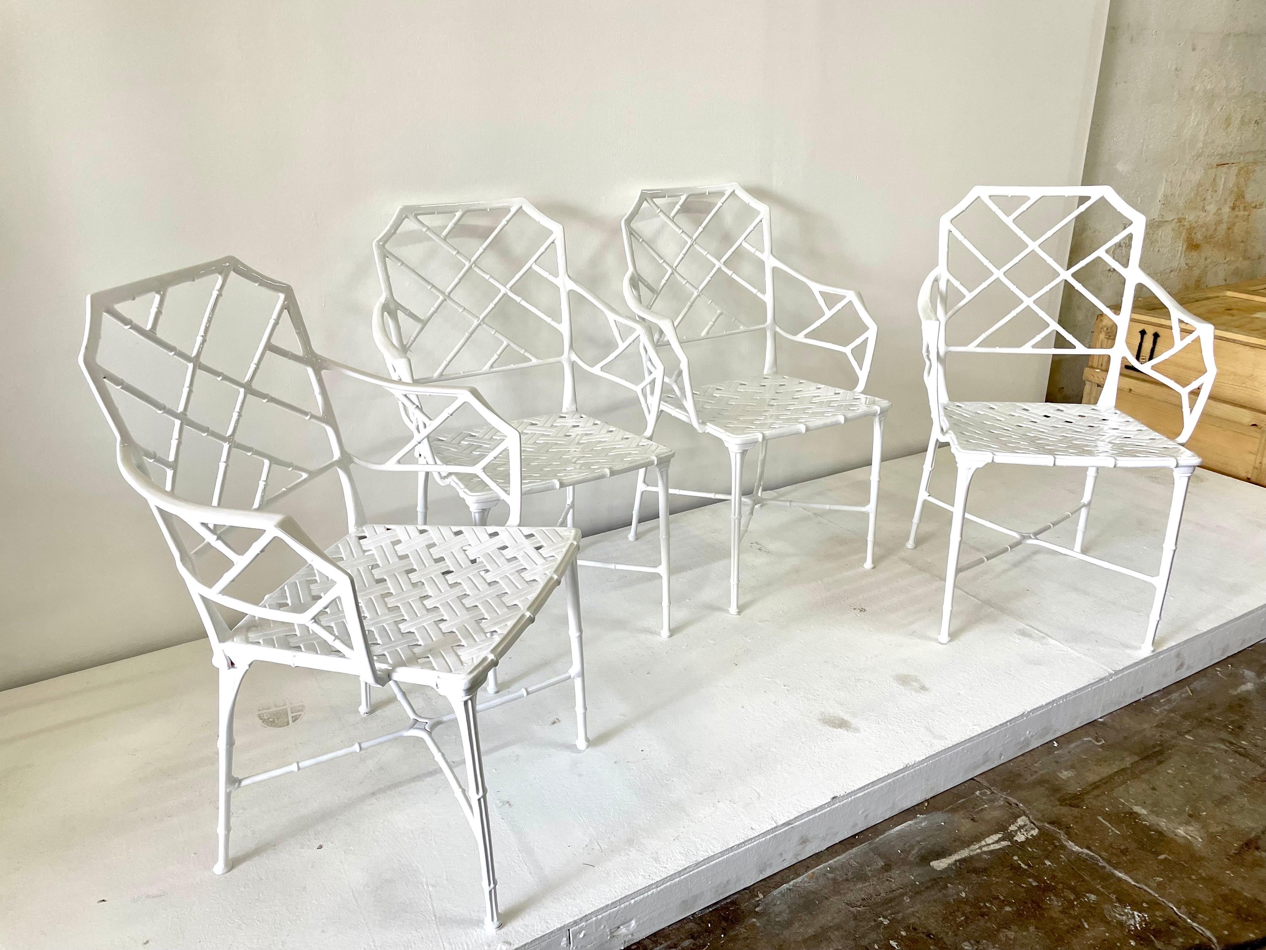 Classic set of 4 Chinese Chippendale faux bamboo dining armchairs for outdoor, garden or patio. Recently powder coated in classic white over cast aluminum. Designed by Hall Bradley for Brown Jordan, 1967.

History & details: Calcutta was designed
