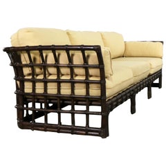 Used Brown Jordan Windowpane Dark Brown Rattan Sofa with Straw Colored Cushions