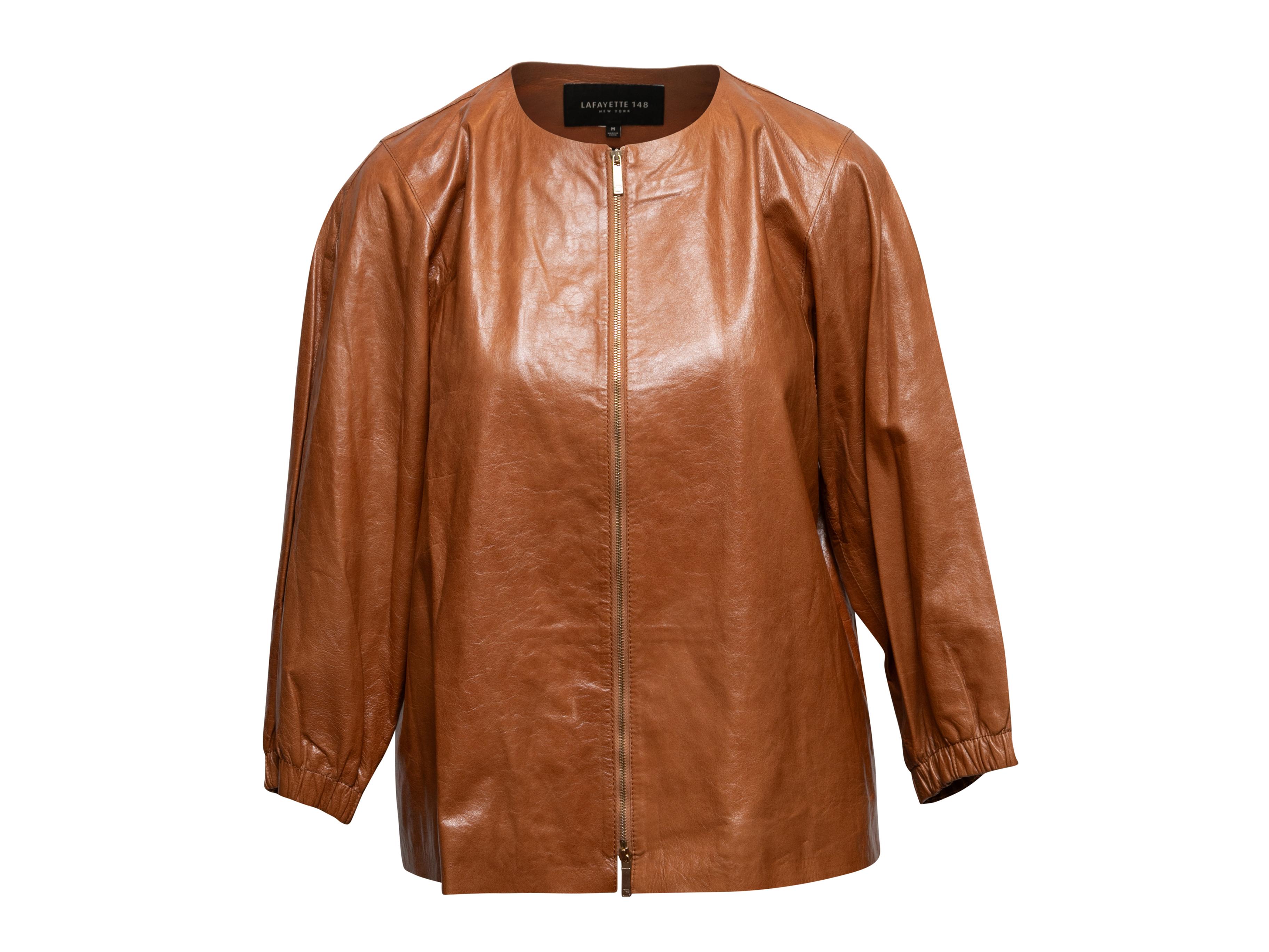 Brown leather collarless jacket by Lafayette 148. Crew neck. Zip closure at center front. 40