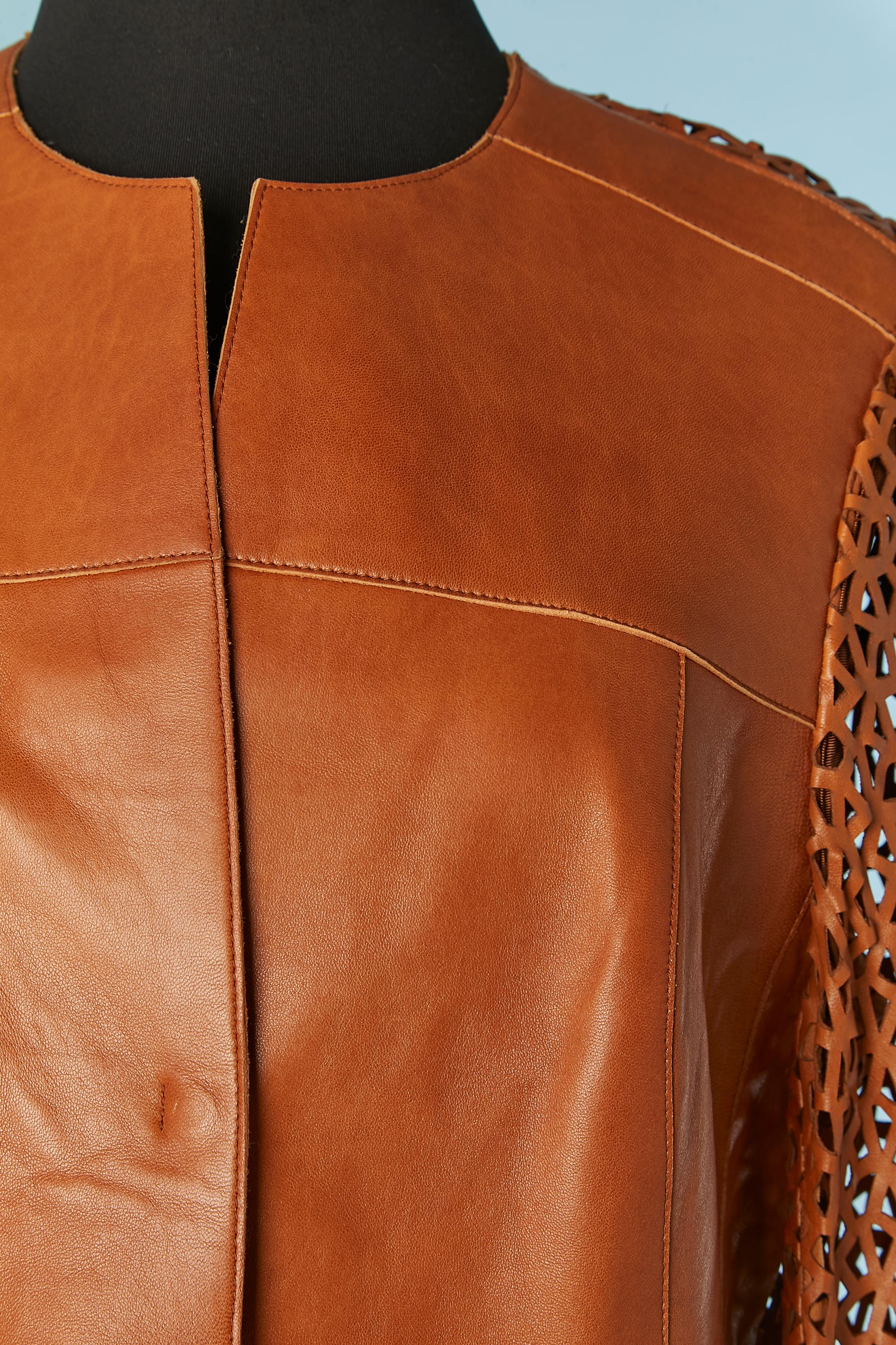 Brown single breasted jacket with laser cut on sleeves and back. 
Lining composition ( only on the front) : 51% rayon, 49% acetate.
Snap closure on the middle front. Cut-work. Pocket on both side. 
SIZE 42 (Fr) 10 (US) L
