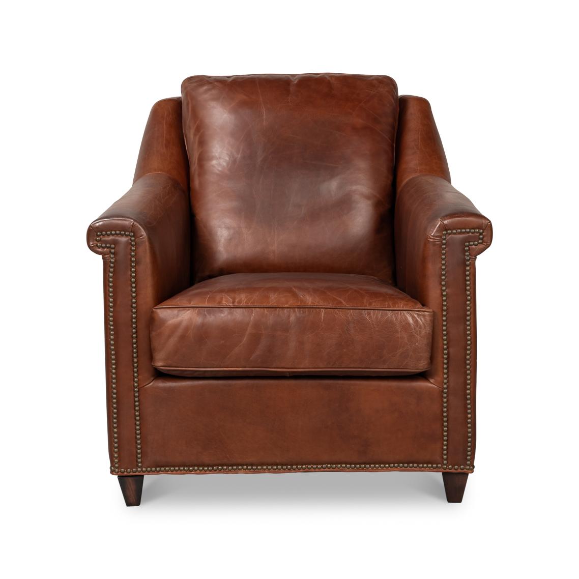 Upholstered in rich Newark Brown leather, this chair is designed to make a statement. Its contrasting oak wood frame adds a touch of classic charm, while the nailhead trim along the edges provides refined detailing and sophistication.

Ideal for