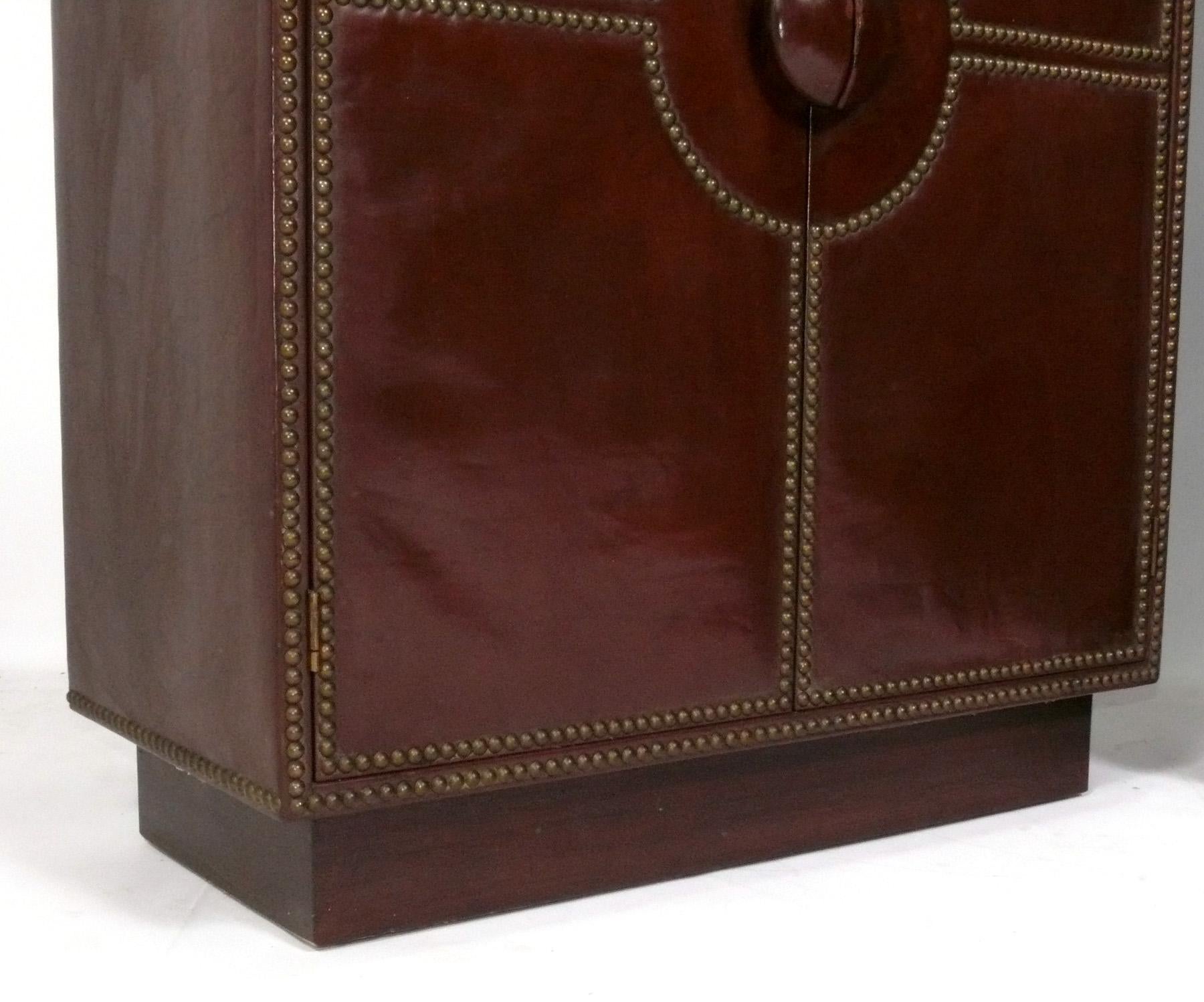 Brown Leather and Brass Studded Cabinets, circa 1930s In Good Condition In Atlanta, GA