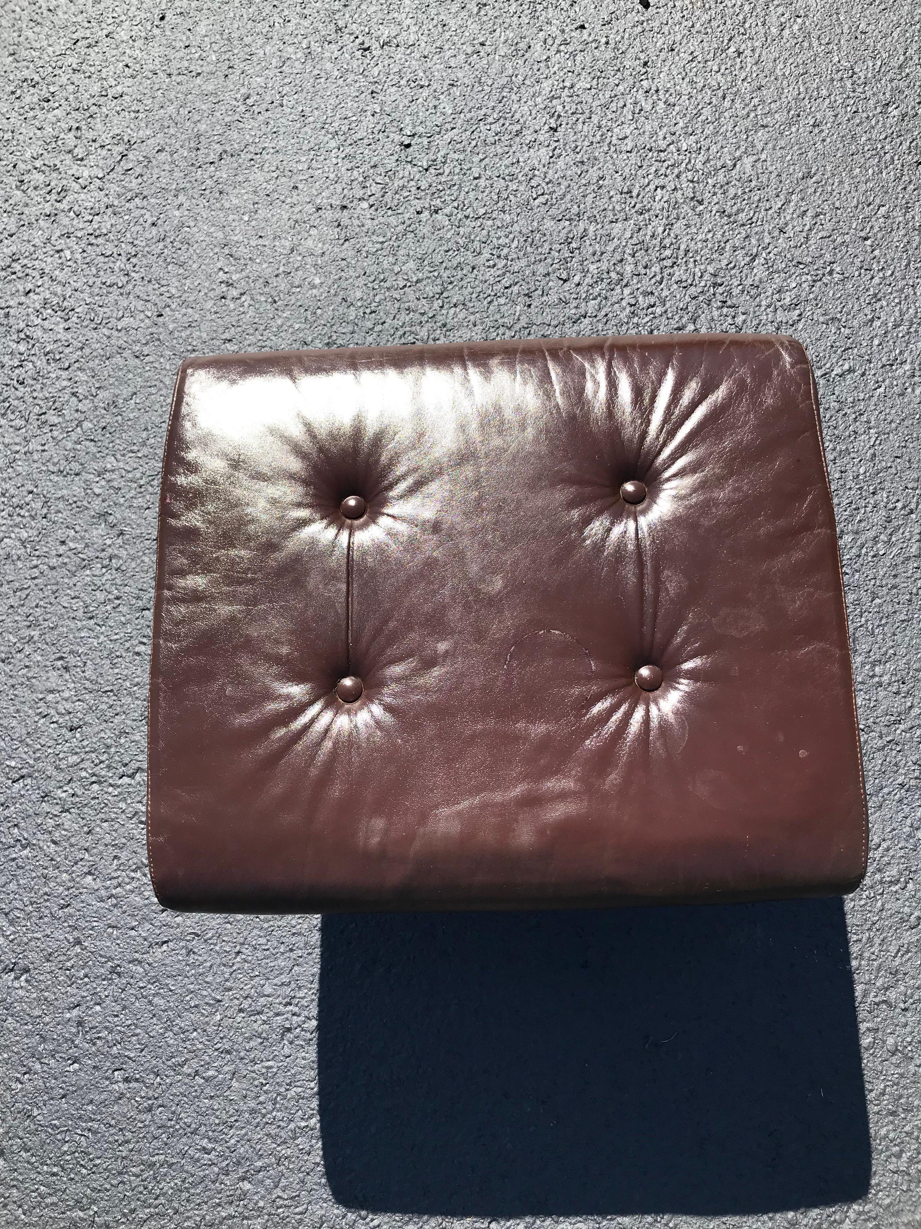 Brown leather and chrome Plycraft ottoman. Swivels. Perfect match for a Plycraft lounge swivel chair. This item should parcel ship for $75 . Please request a parcel shipping quote.