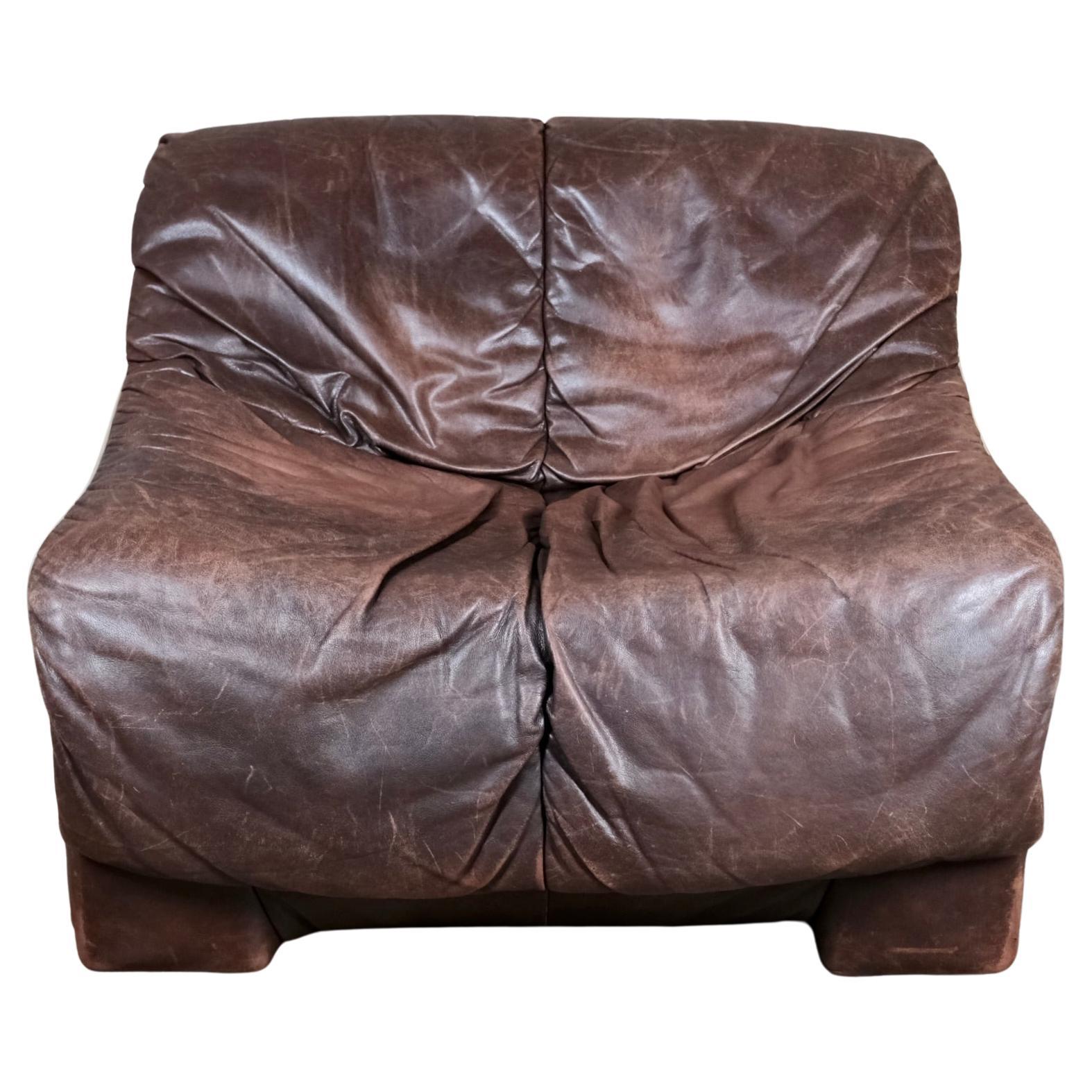 Brown leather armchair in the style of De Sede, made in France, 1980s