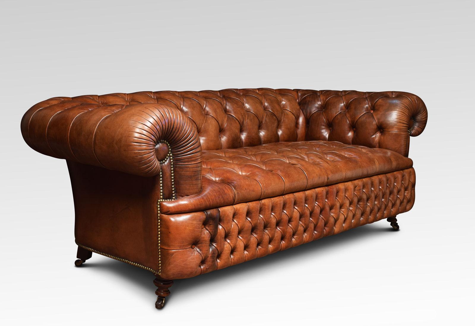 Large three-seat brown leather chesterfield sofa, having deep buttoned back and seat, raised up on turned feet with brass ceramic castors. Good solid condition, the leather is soft, nicely worn in.
Dimensions:
Height 30 inches height to seat 20