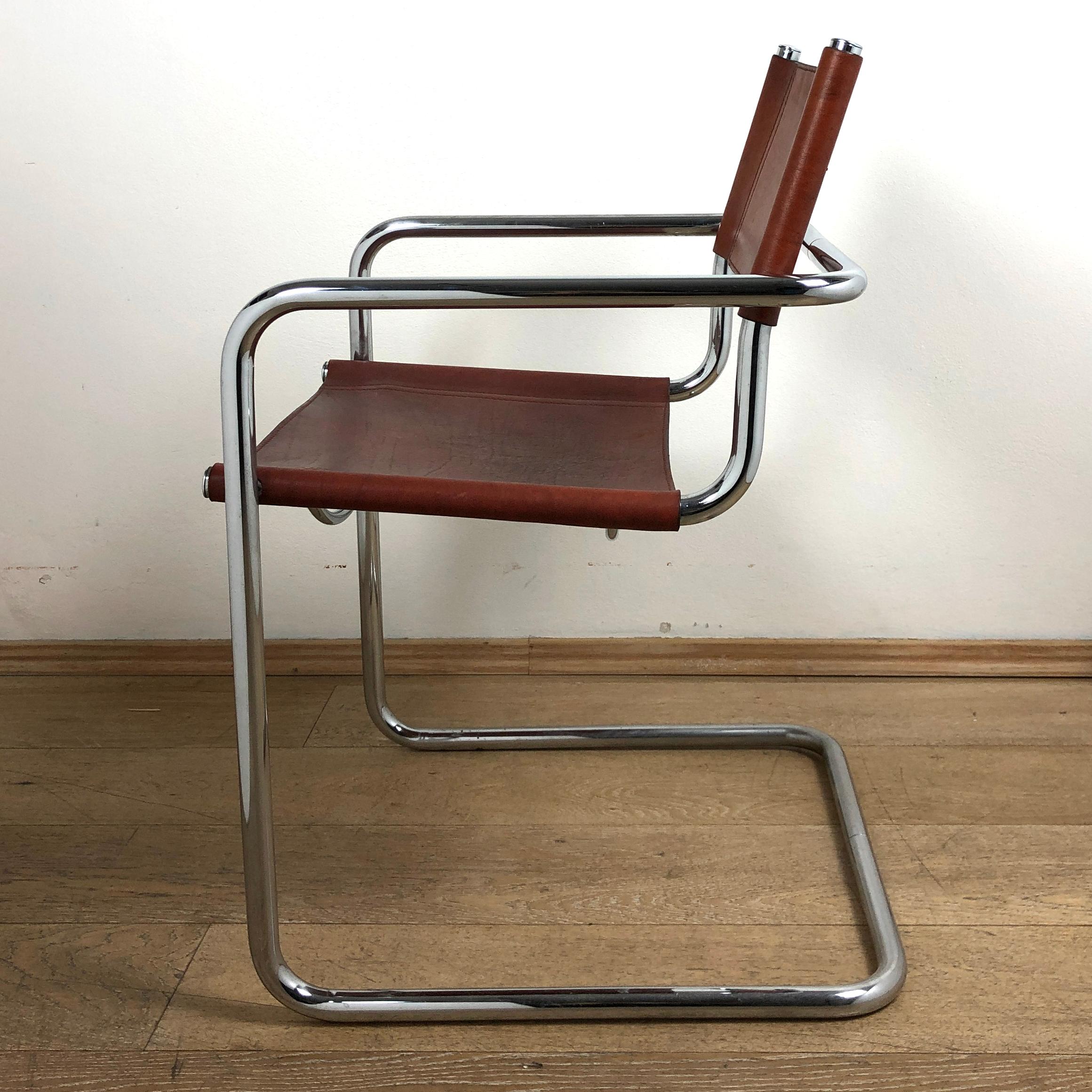 Frame chrome-plated tubular steel cantilever chair made according the famous iconic chair S33 designed in 1926 by Mart Stam.
This chairs have deep intense leather seats, backrests and armrests with wonderful original patina. The leather is in