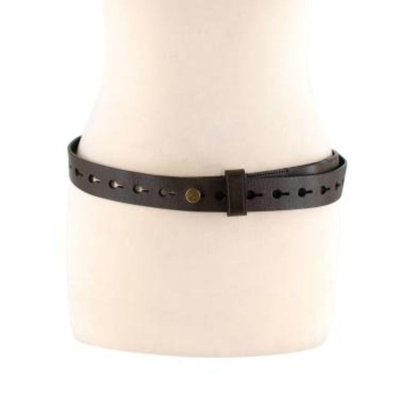 Fendi Brown leather gold-tone stud belt 
 

 - Supple dark brown leather with punched holes
 - Logo-embossed gold-tone metal stud closure
 - Fully adjustable to fit a range of sizes
 - Can be worn on the waist or hip
 

 Materials
 Leather
 Metal
