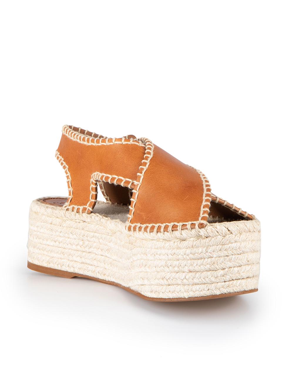 CONDITION is Never Worn. Visible wear to shoes is evident to both with scuff marks at the leather strapping due to poor storage on this used Chloé designer resale item.



Details


Brown

Leather

Platform espadrille sandals

Whip stitch