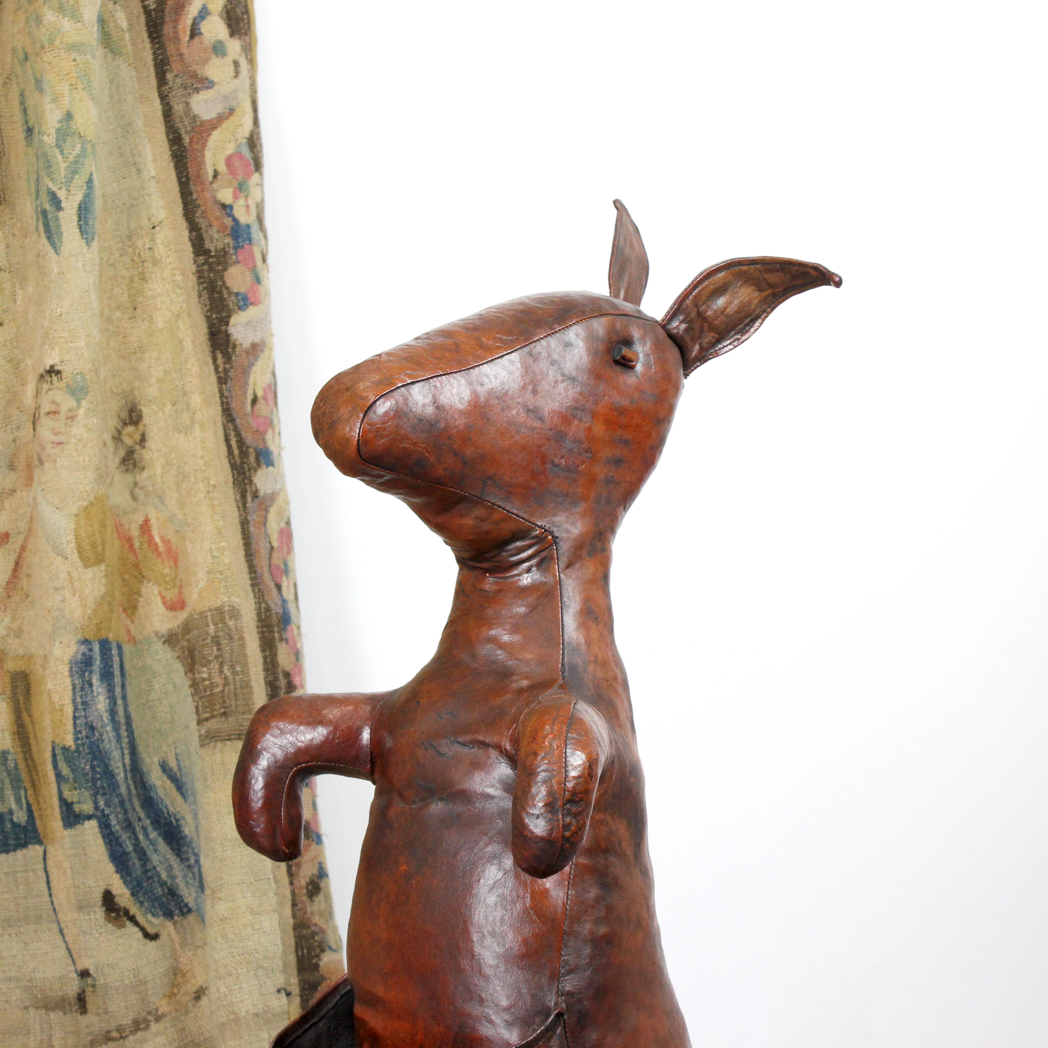 Brown leather kangaroo-shaped magazine holder from Almazán, Spain, circa 1970.  Stamped.