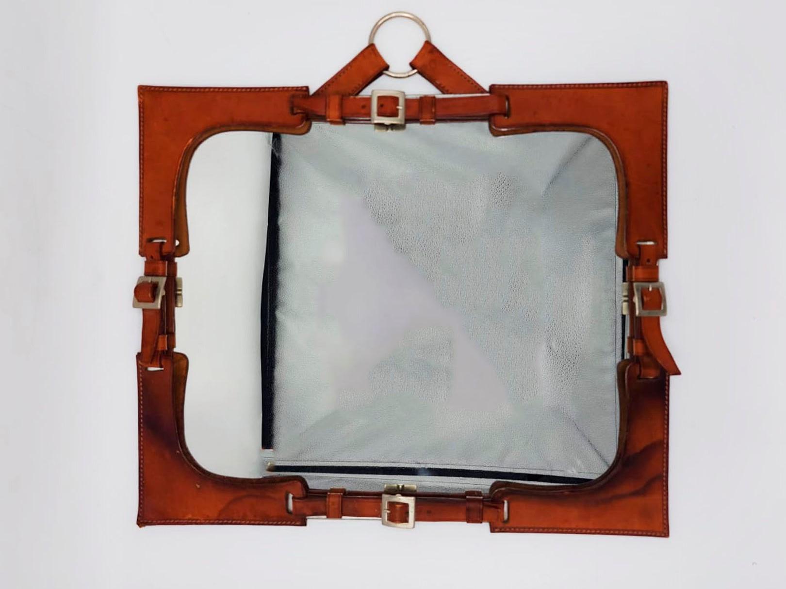 Brown leather mirror in the style of Hermes Paris, 20th Century

Hermes Paris style mirror from 1970, made of rustic style leather, this piece has at each end as if it were hooked with a belt style buckle
Measures:
Height: 46 Centimeters
Length: