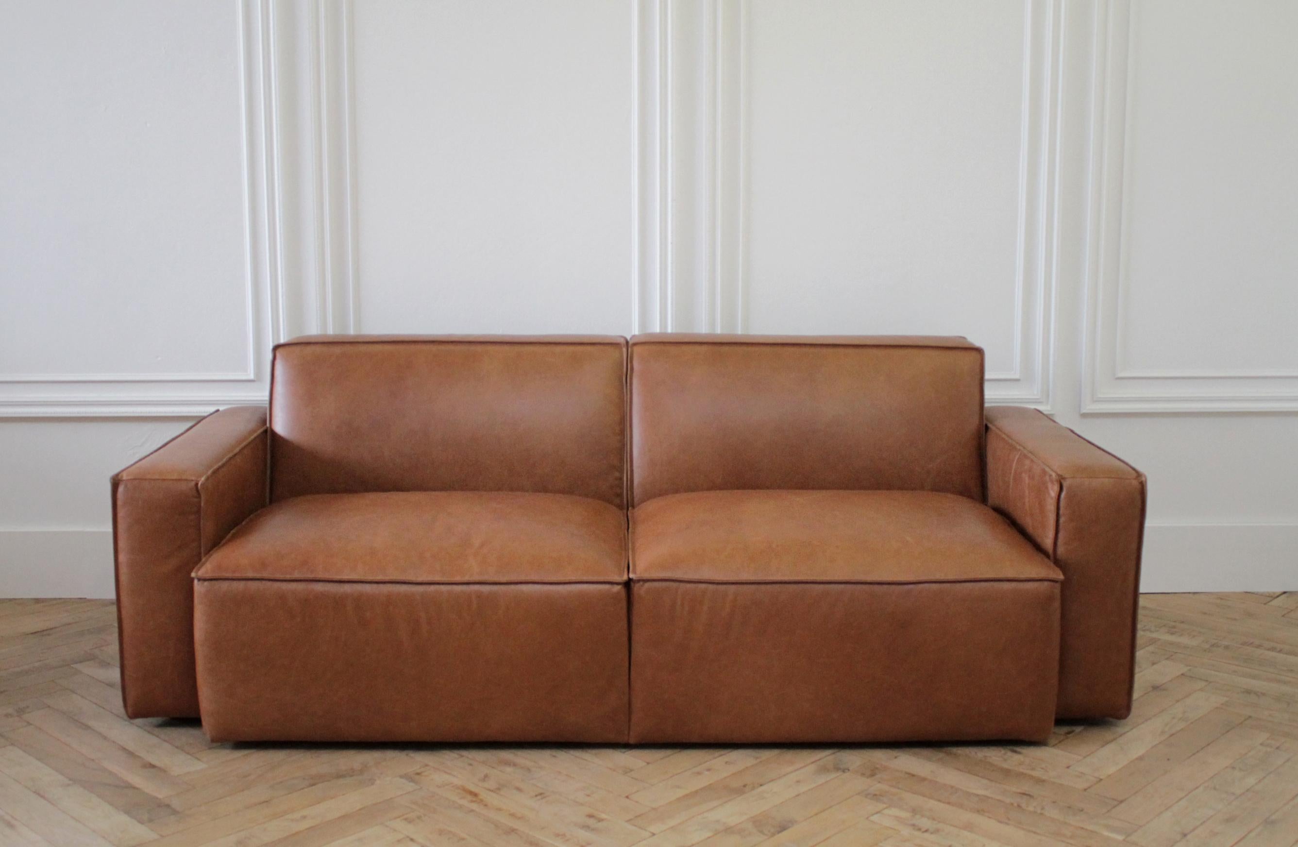 Brown leather modern square sofa
2 available, sold separately
Very Comfortable, arms are highly padded, seats have a medium firm comfort. Very supportive.
Measures:
 82