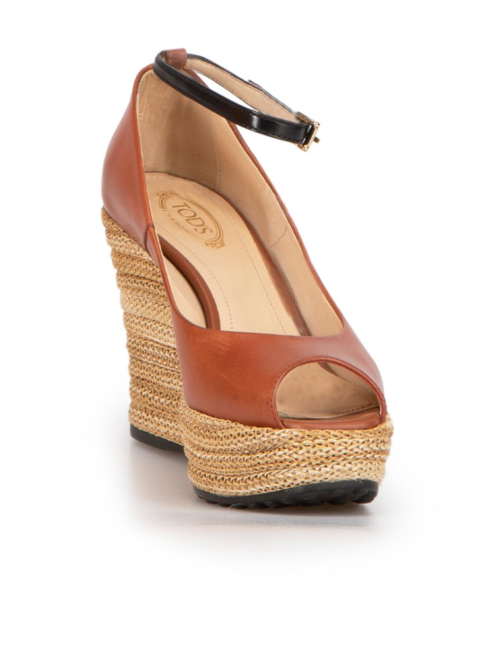 CONDITION is Good. Minor wear to shoes is evident. Light wear to both sides and heels of both shoes with scuff marks on this used Tod's designer resale item. These shoes come with original box.



Details


Brown

Leather

Espadrille wedge