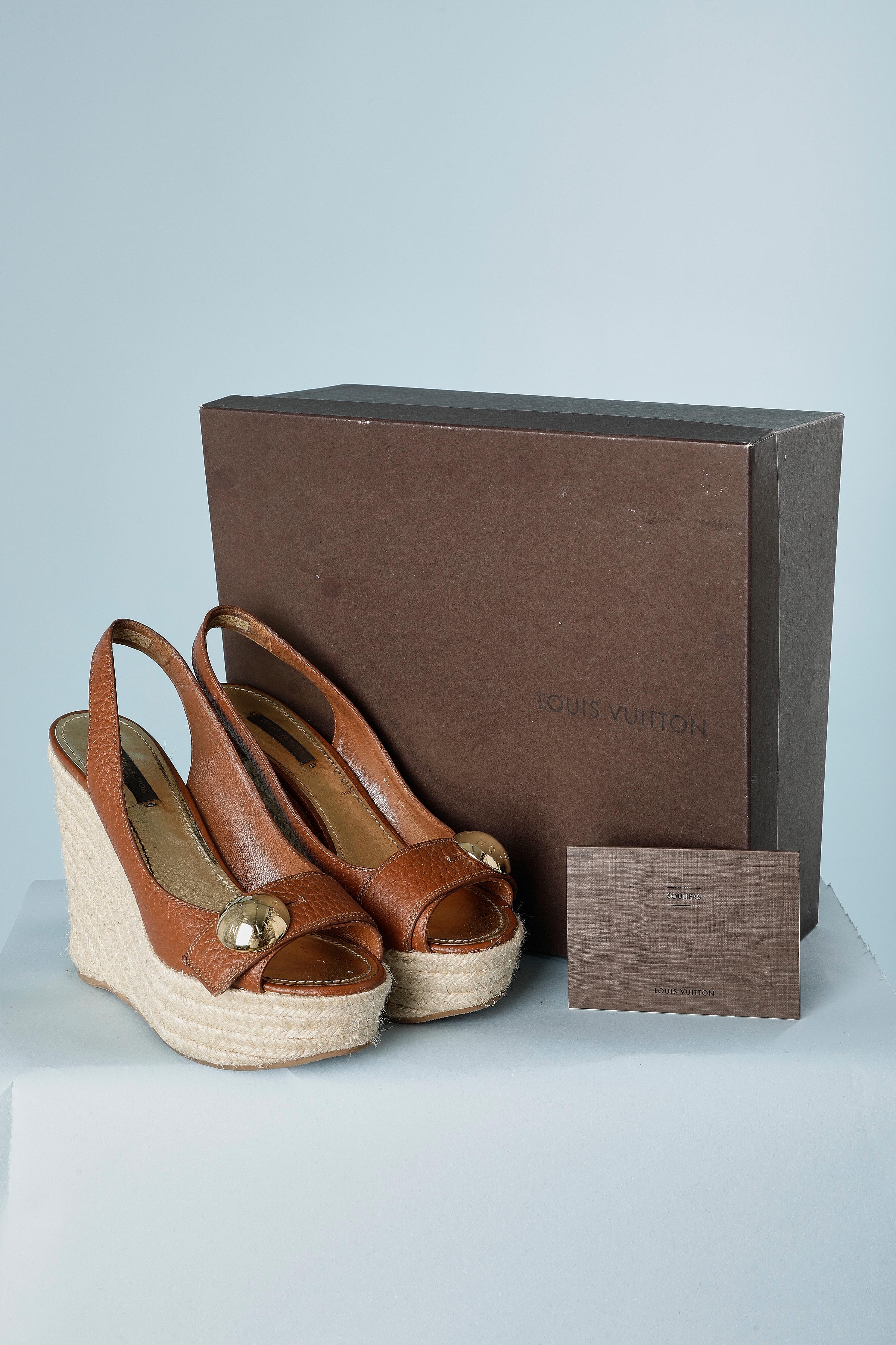 Brown leather platform sandal with cord heels. Gold metal branded button and buttonhole ( decorative only) Provided with box and card.
Total height = 13 cm 
Platform height = 4 cm
Shoe size= 37 ( It) 