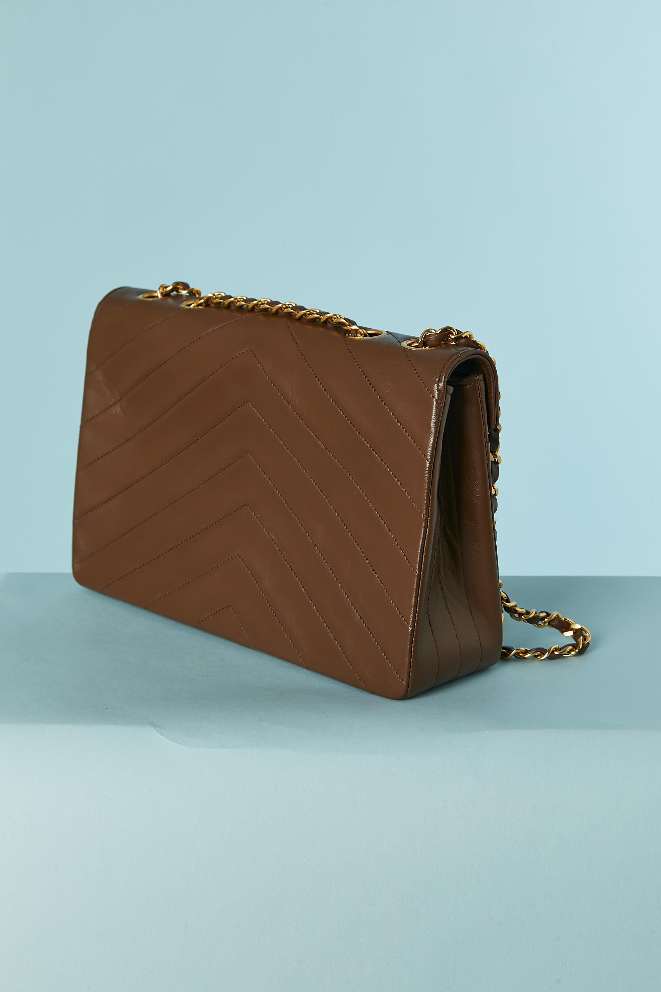 Brown leather shoulder bag with top-stitching and chain Chanel Circa 1984 For Sale 1